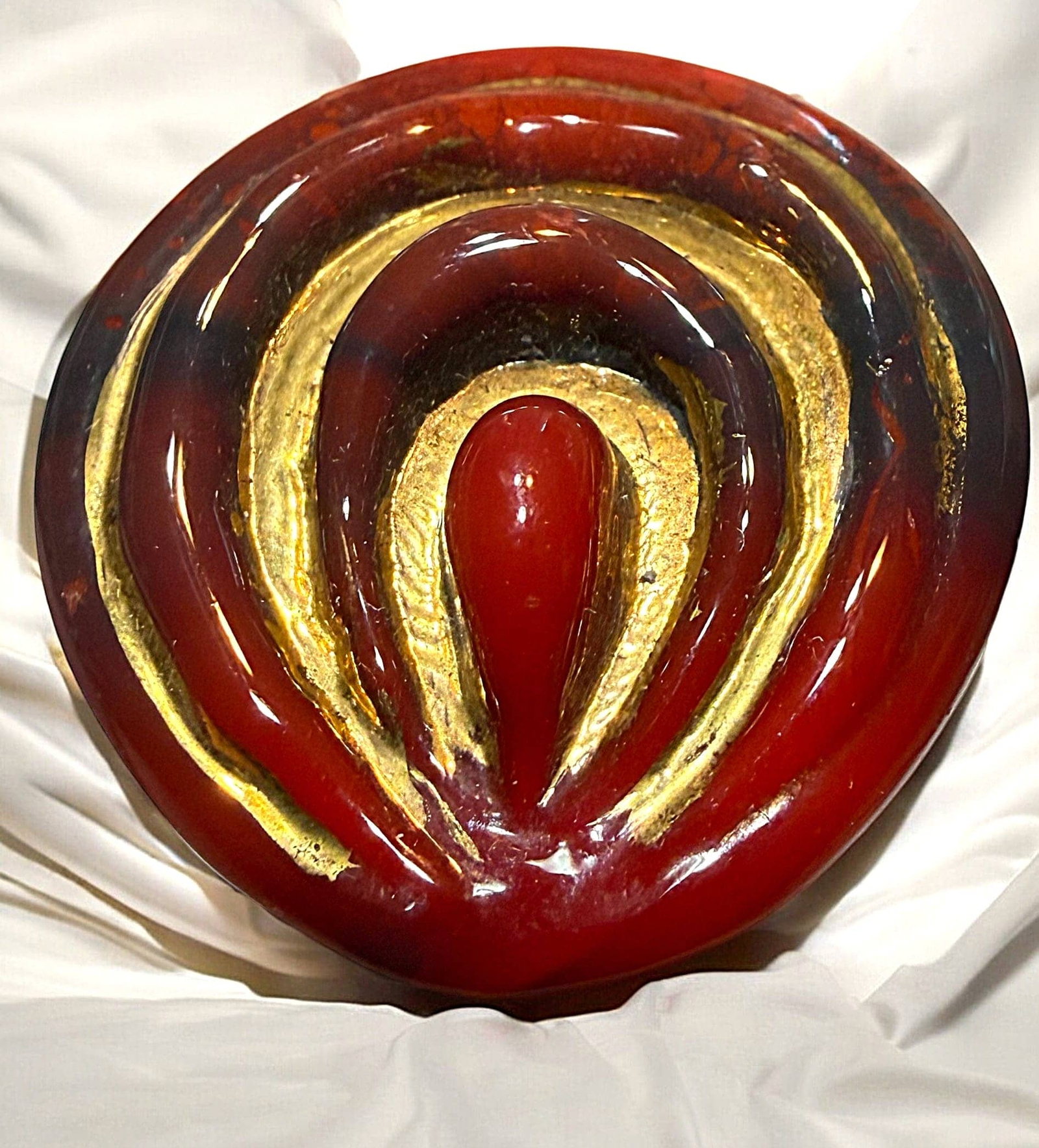 A DIVISION THREE ENGLISH GLASS BUTTON: 1 Large 1940's RED backmarked Bimini glass example. This non pictorial example of Bimini glass is still quite stunning in its design and gold lustered finish. Red is a less common color to find in Bim