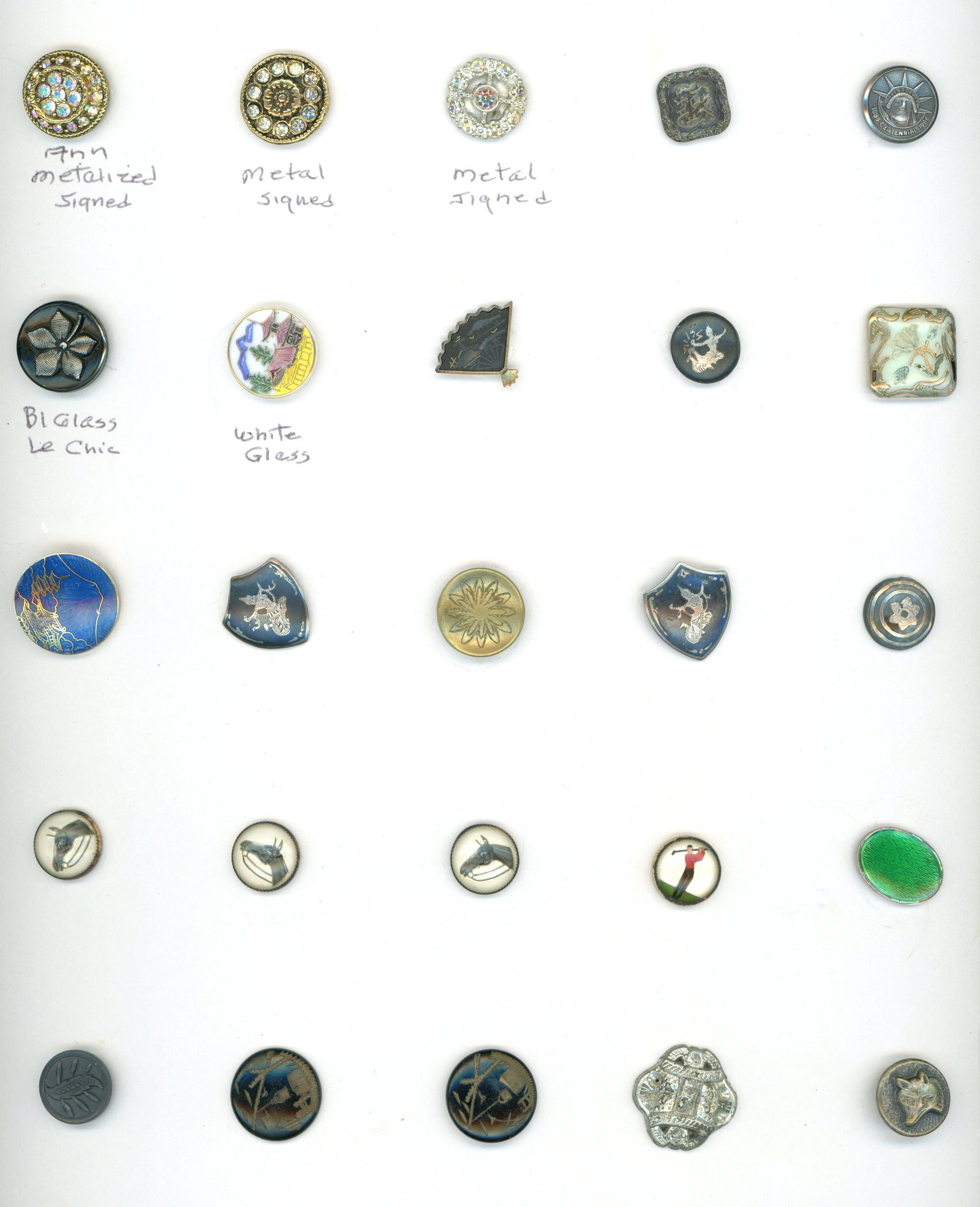A CARD OF DIVISION 1 & 3 ASSORTED MATERIAL BUTTONS: 25 Small 19th/20th century examples in assorted techniques. This card a work card of Connie Robinsons includes Damascene, Niello. Enamels, Glass and more. DimensionsSM=Less than 3/4", Medium=3/4" to 1