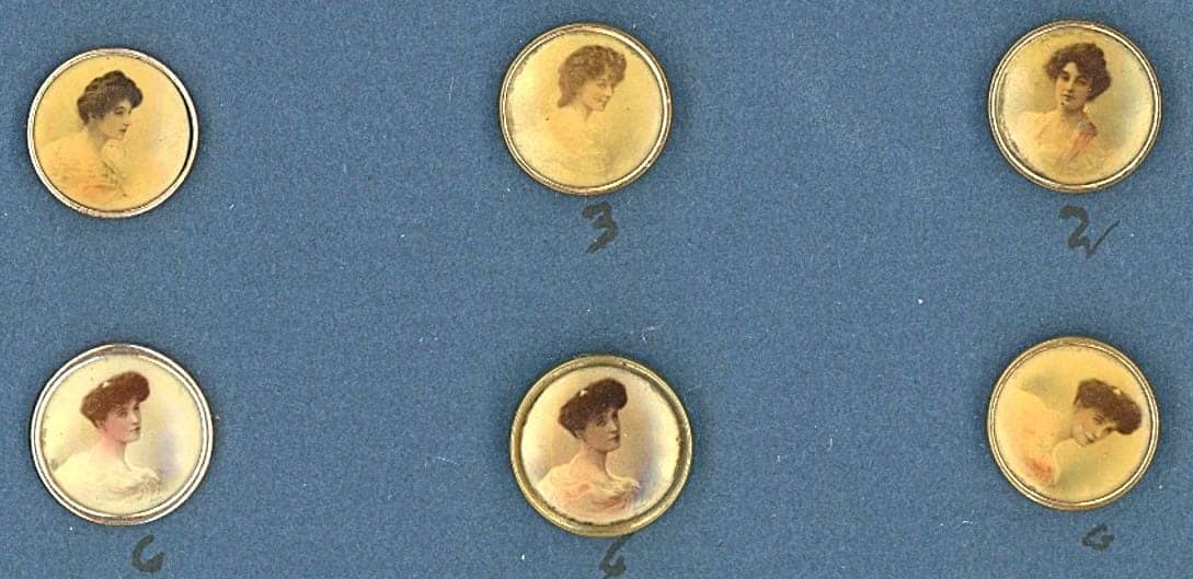 A SMALL CARD OF DIVISION ONE LITHO BUTTONS: 6 Small 19th century examples in the Birmingham trade style. This small card is for those buttons that are similar to the mountings used on Birmingham trade buttons and are centered with a lithograph