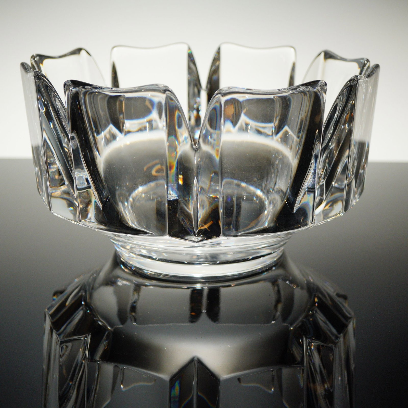 Orrefors Corona Crystal Bowl designed by Lars Hellsten: A single Orrefors Crystal Bowl, known as the 'Corona' pattern, designed by Lars Hellsten. This heavy, thick-walled crystal piece features a distinctive, geometric, modernist design. The rim is defined