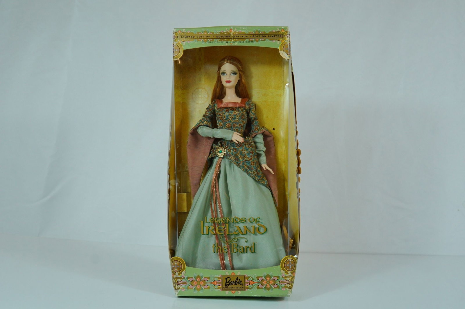 Mattel, Legends of Ireland "The Bard" Barbie Doll, 11.5 Inches: Manufactured by Mattel as part of the Barbie Collectibles Legends of Ireland Collection, this vinyl fashion doll is titled "The Bard." The doll features rooted long wavy auburn hair and fixed painted