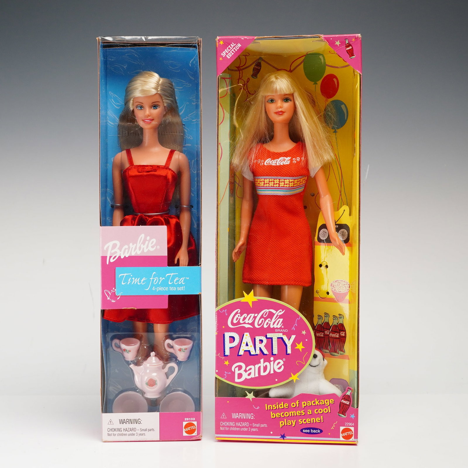A Pair of Mattel Barbie Dolls, Time for Tea and Coca-Cola Party, 11.5 Inches: Mattel, vinyl, boxes marked with item numbers 29103 and 22964. These dolls feature rooted blonde synthetic hair and painted blue fixed eyes. Time for Tea Barbie wears an original red satin-style dress