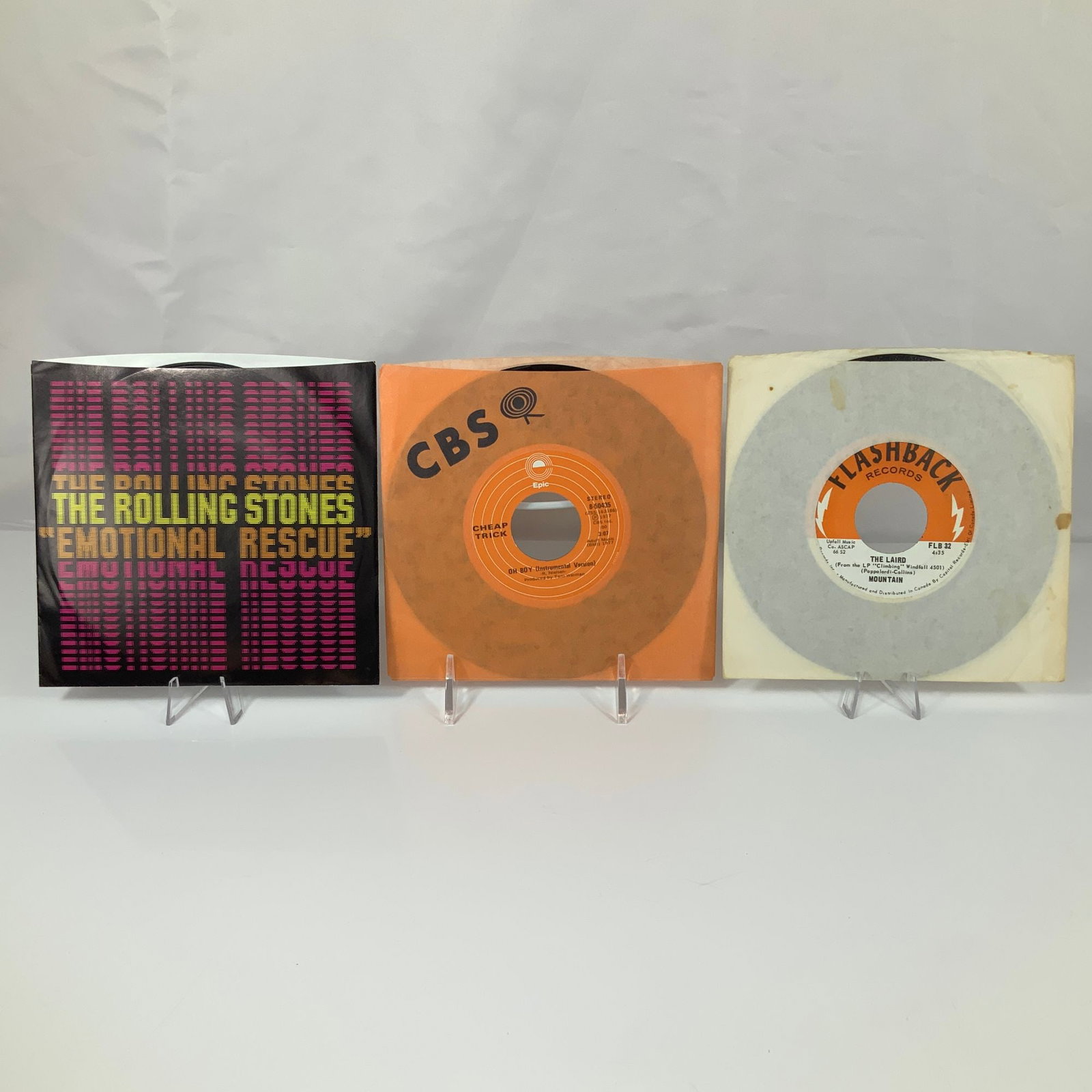 A Trio of Rock 45 RPM Vinyl Records Including The Rolling Stones, Cheap Trick, and Mountain (1 of 2)