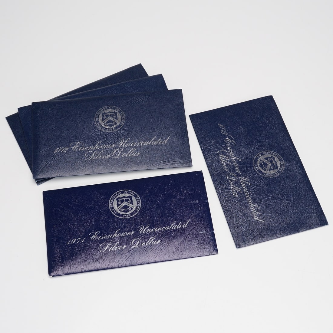 5pc 1971-S, 1972-S, 1973-S Eisenhower Uncirculated Silver Dollar Coins: This lot includes five 1971-S, 1972-S, and 1973-S Eisenhower Silver Dollar coins, all minted at the San Francisco Mint. The set consists of one 1971-S coin, three 1972-S coins, and one 1973-S coin, ea