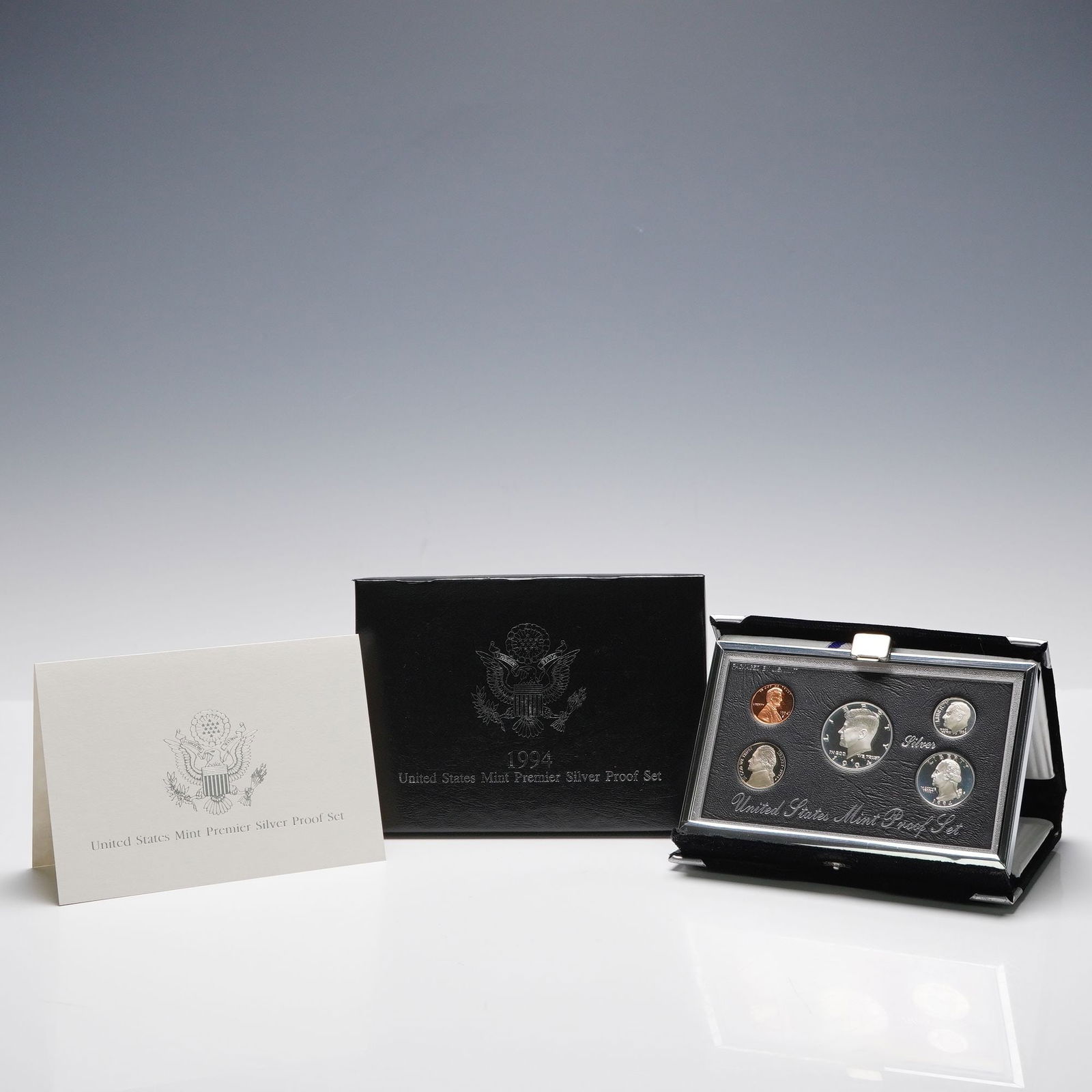 1994-S United States Mint Premier Silver Proof Set: This 1994 United States Mint Premier Silver Proof Set includes five coins presented in a deluxe black velvet case with silver trim and accompanied by the original Certificate of Authenticity and outer