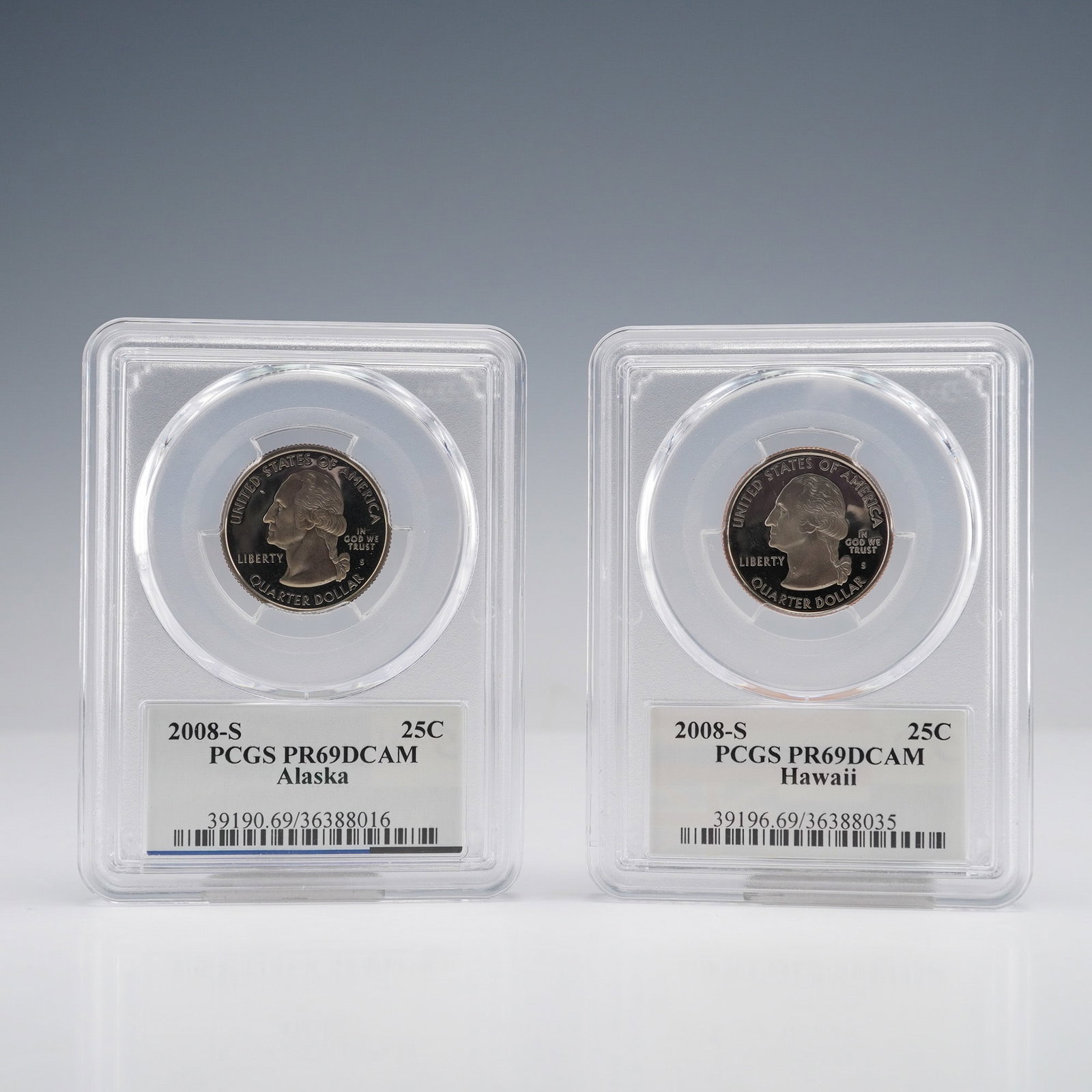 2pc US 2008-S 25C Silver Proof Alaska & Hawaii PCGS PR69DCAM: A pair of United States Statehood Quarter Dollars, struck in Proof format at the San Francisco Mint (S). This lot includes the 2008 Alaska issue and the 2008 Hawaii issue. Both coins feature the stand
