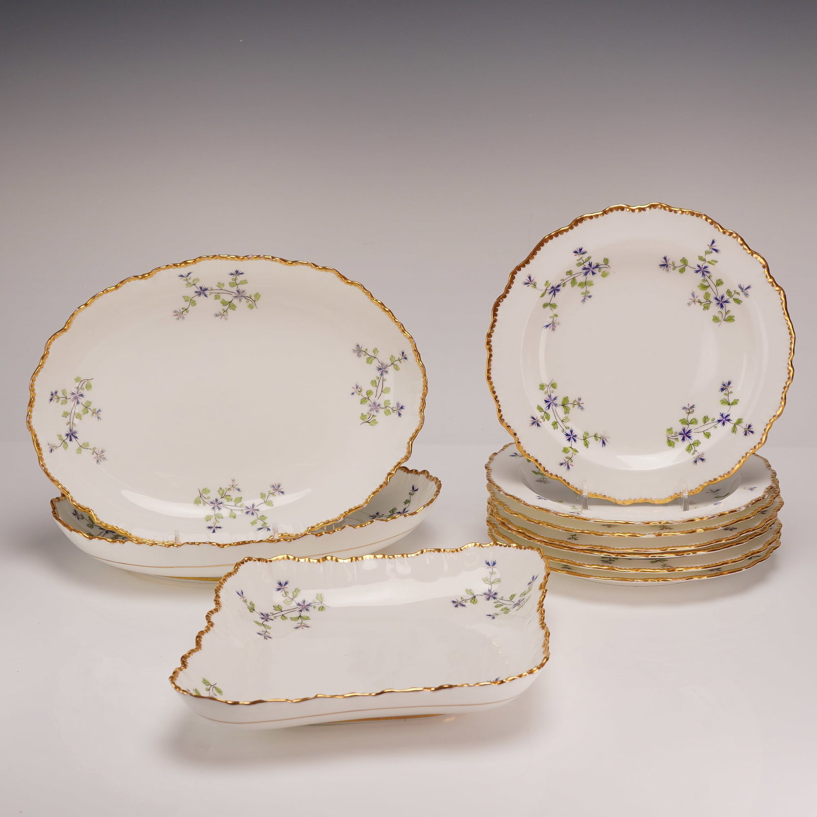 10 Piece Cauldon China Cornflower Pattern Dessert Service for Mortlock's: This 10 piece fine bone china service was manufactured by Cauldon China in England for the retailer Mortlock's of Oxford Street, London. The set is decorated with a floral pattern featuring blue and p
