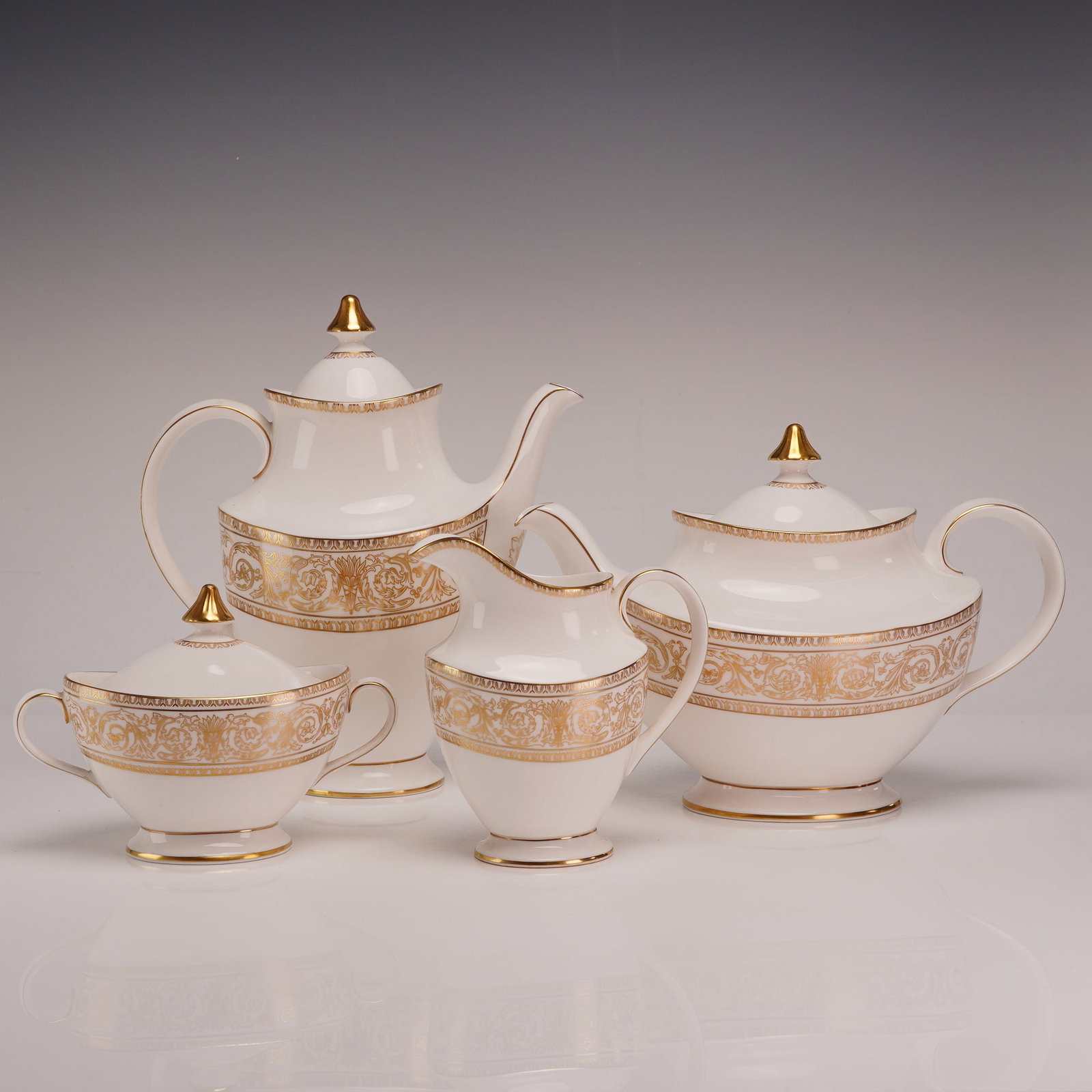 Royal Doulton Sovereign Pattern H.4973 English Fine Bone China 4-Piece Tea and Coffee Service: This 4-piece set of Royal Doulton fine bone china is decorated in the Sovereign pattern, designated by the pattern code H.4973. The service includes a tall, slender coffee pot with a high-domed lid, a