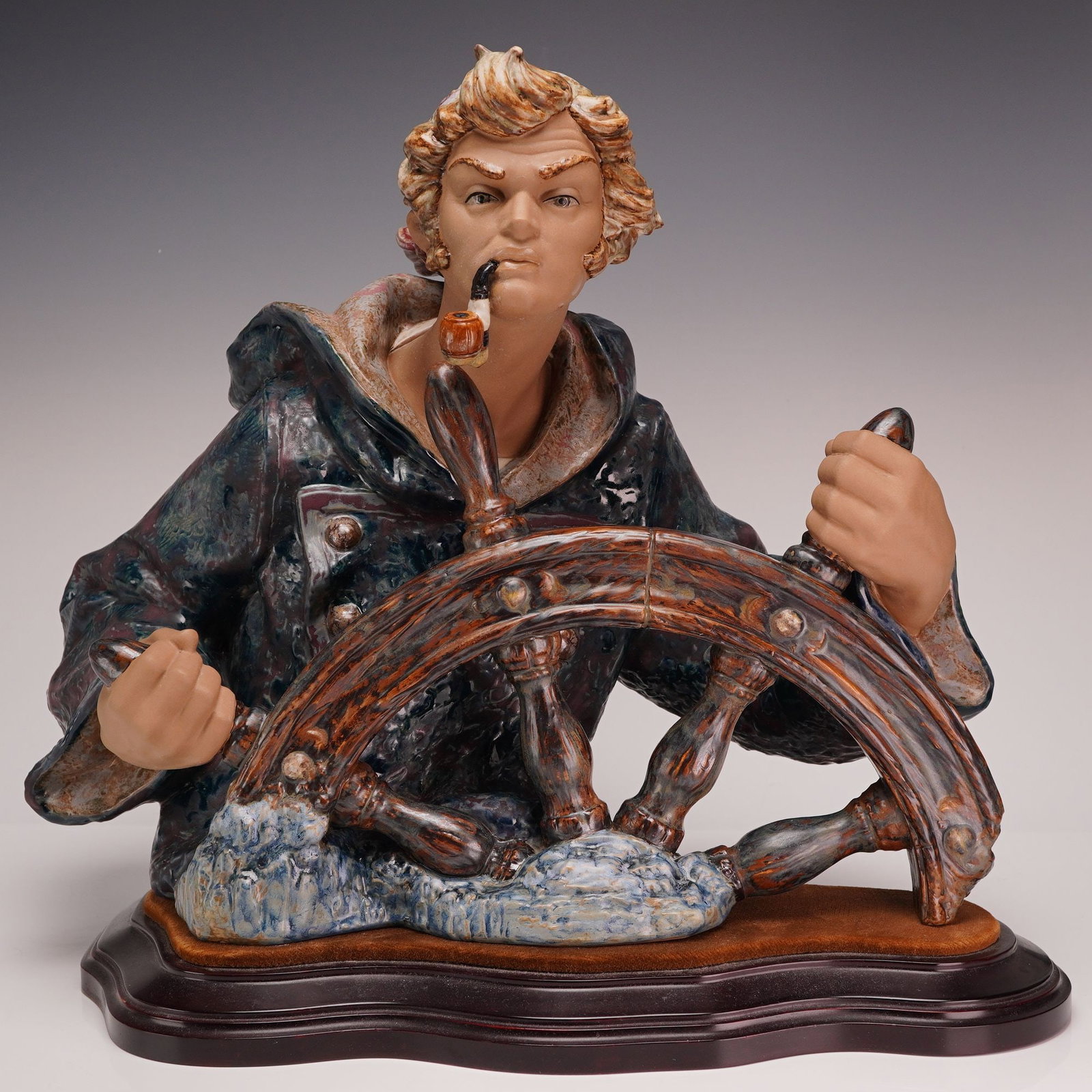 Capodimonte Seaman Helmsman Sailor Porcelain Figure Mariner at the Wheel: This porcelain sculpture, identified as the Helmsman or Mariner at the Wheel, bears the factory mark of Capodimonte. This rare and collectible figure depicts a male seaman at the wheel of a ship, show