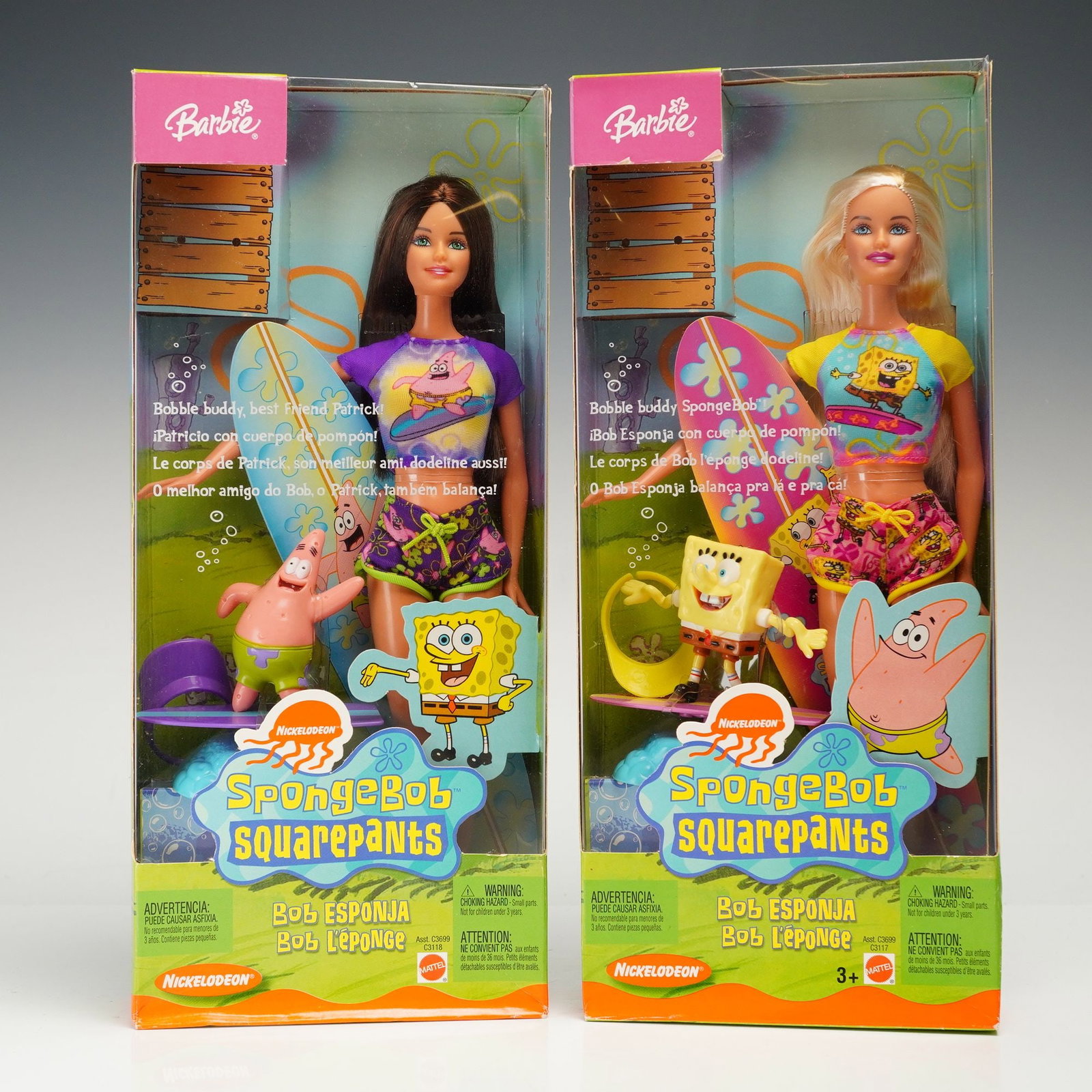 A Pair of Mattel SpongeBob SquarePants Barbie Dolls: A pair of Mattel vinyl fashion dolls themed after the Nickelodeon animated series SpongeBob SquarePants, released in 2003. The set includes one brunette doll (Model C3118) and one blonde doll (Model C