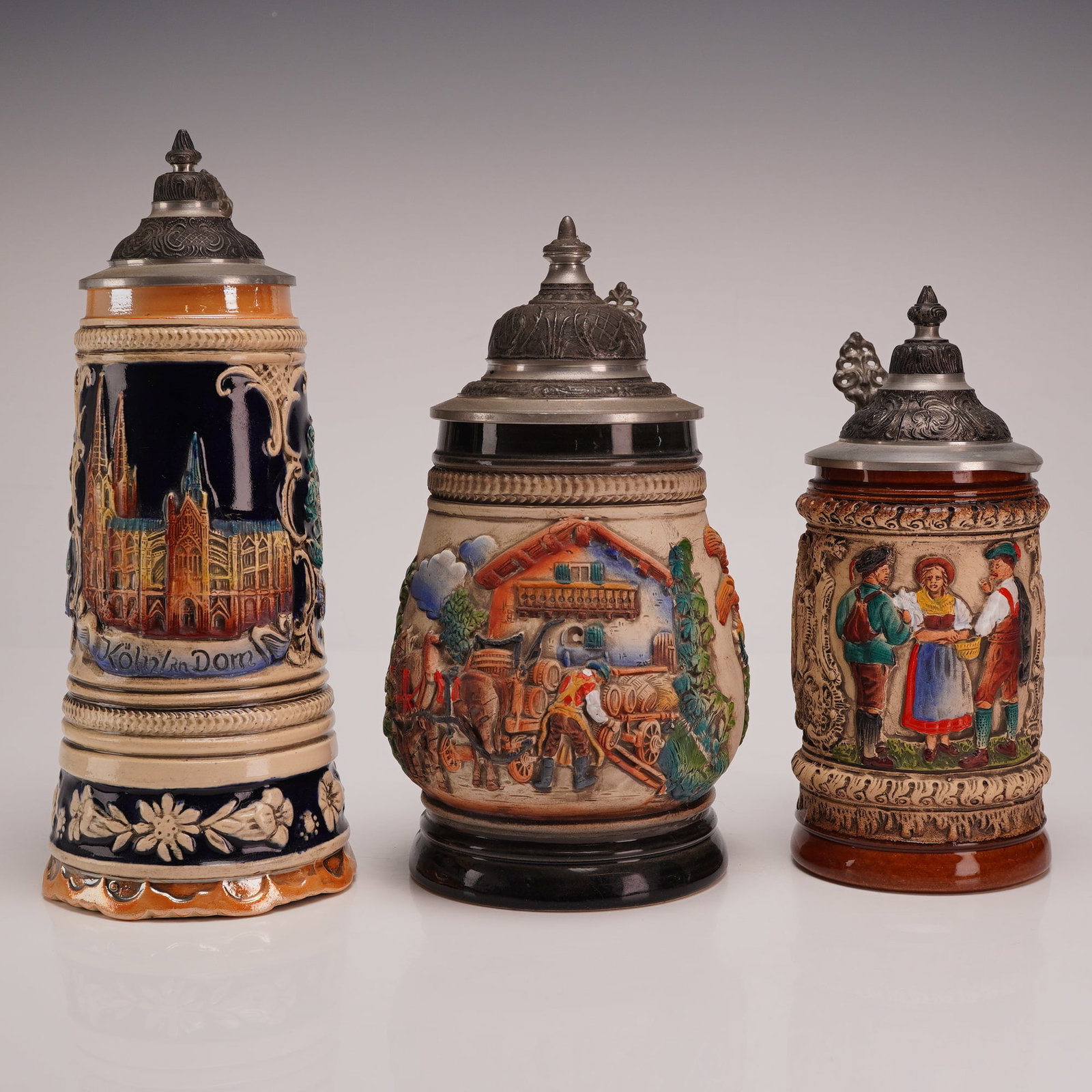 Set of 3 German Relief-Molded Beer Steins including King-Werk and Mapsa Swiss Musical Movement (1 of 4)