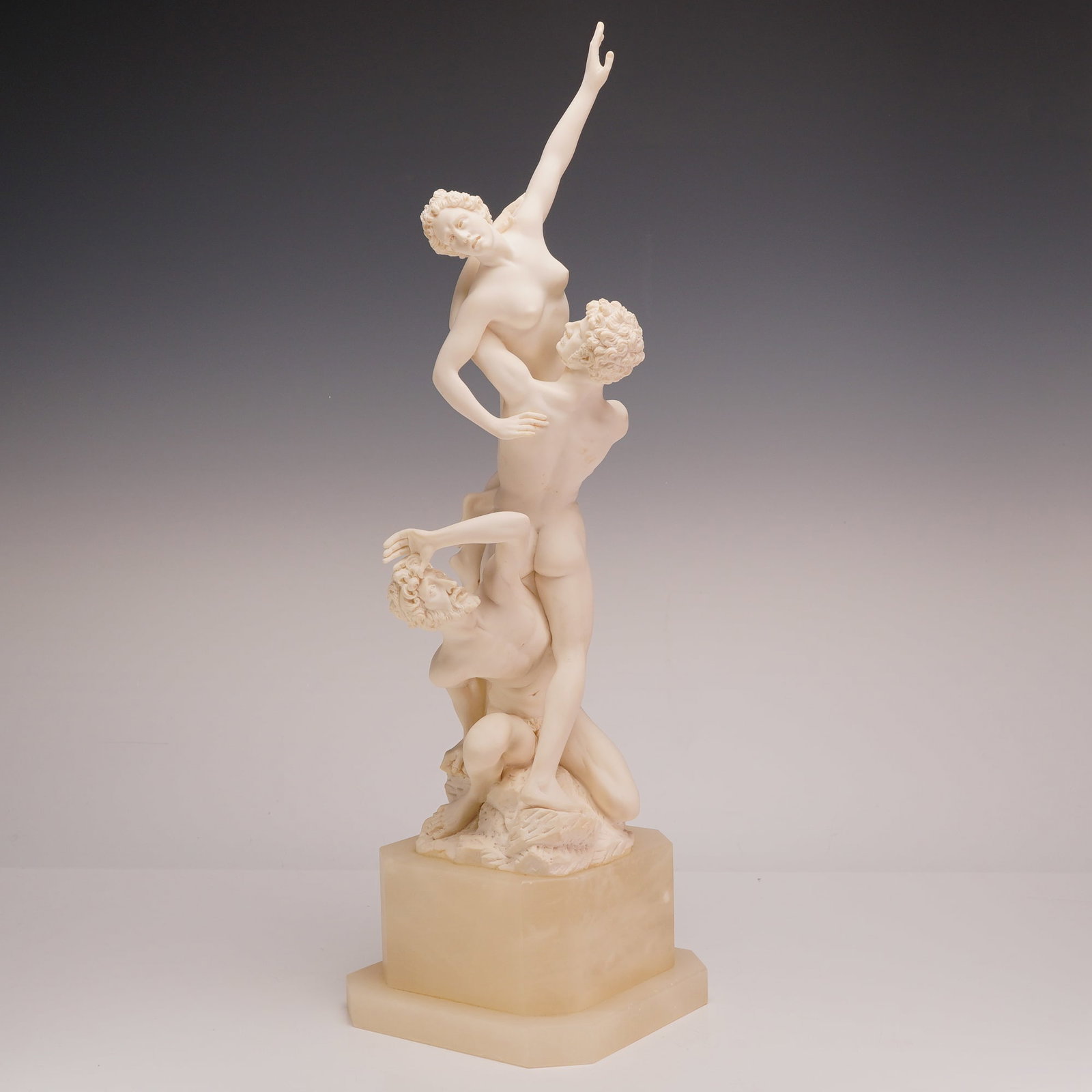 A. Giannelli, Large Vintage Rape of the Sabine Women Sculpture on Alabaster Base, 1970: Produced by A. Giannelli, this large vintage figurative sculpture is a bonded marble or white stone composite reproduction of the Mannerist group the Rape of the Sabine Women by Giambologna. The compo