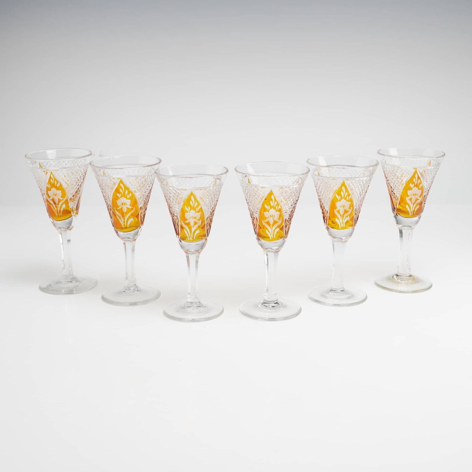 Bohemian Czech Cut-to-Clear Amber Etched Floral Crystal Cordial Glasses, Set of 6: This professional set of six (6) Bohemian cut-to-clear amber etched cordial glasses exemplifies the high-quality craftsmanship associated with mid-20th-century Czech and German crystal works. Each gla