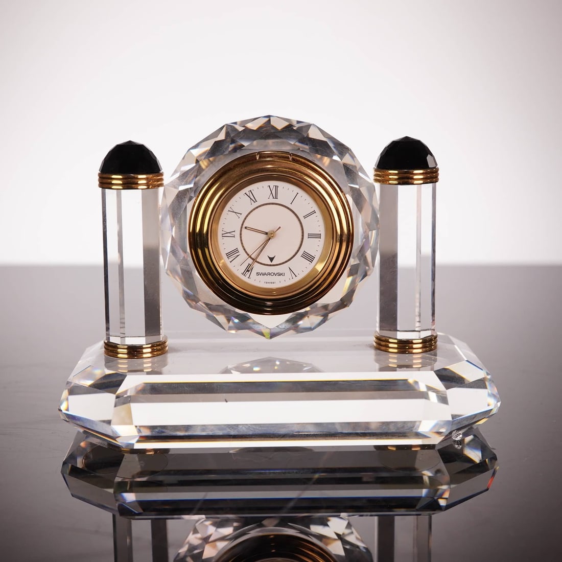 Swarovski Belle Époque Gold Mantel Clock, Model 25077, Late 20th Century: This professional Swarovski Belle Gold mantel clock, model number 25077, is a refined example of Austrian lead crystal craftsmanship. The timepiece features a high-quality Swiss quartz movement set wi