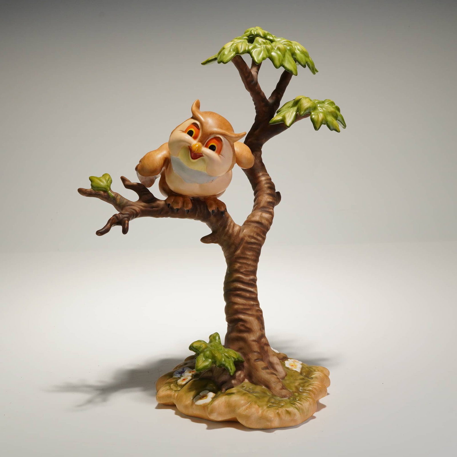 WDCC Bambi Friend Owl Figurine, What's Going On Around Here?: A ceramic figurine produced by the Walt Disney Classics Collection (WDCC), titled "What's Going On Around Here?". The piece depicts the character Friend Owl from the 1942 film Bambi, rendered in a car