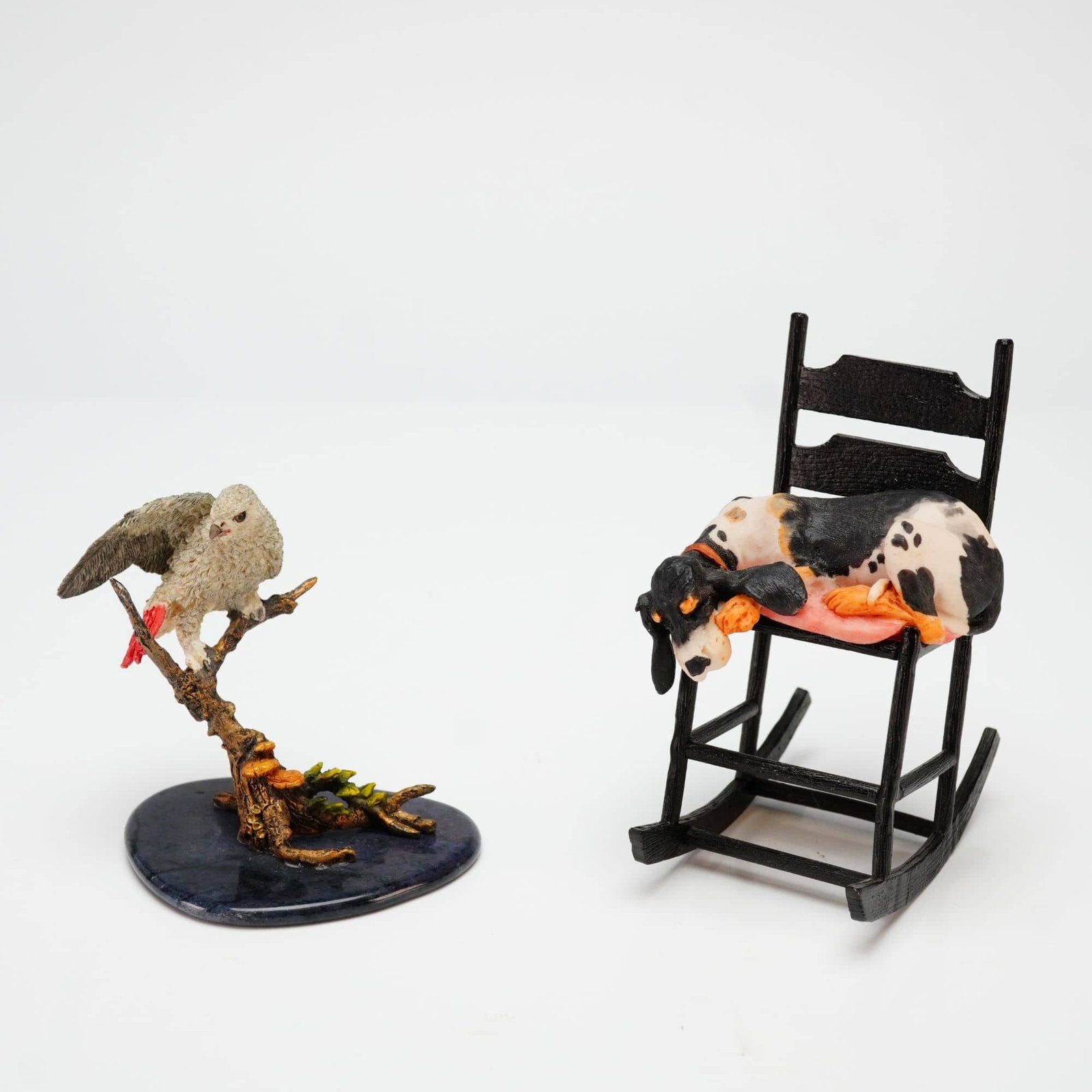 A Pair of Schmid and Tropical Paradise Figurines, Sawin' Logs and African Gray Parrot (1 of 4)