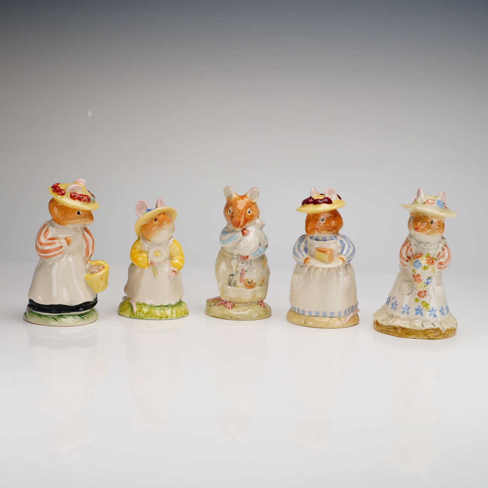 5pc Royal Doulton Brambly Hedge Figurines: A collection of five Royal Doulton porcelain figurines from the Brambly Hedge Gift Collection, inspired by the illustrations of Jill Barklem. The group includes Lady Woodmouse DBH5, Poppy Eyebright DB