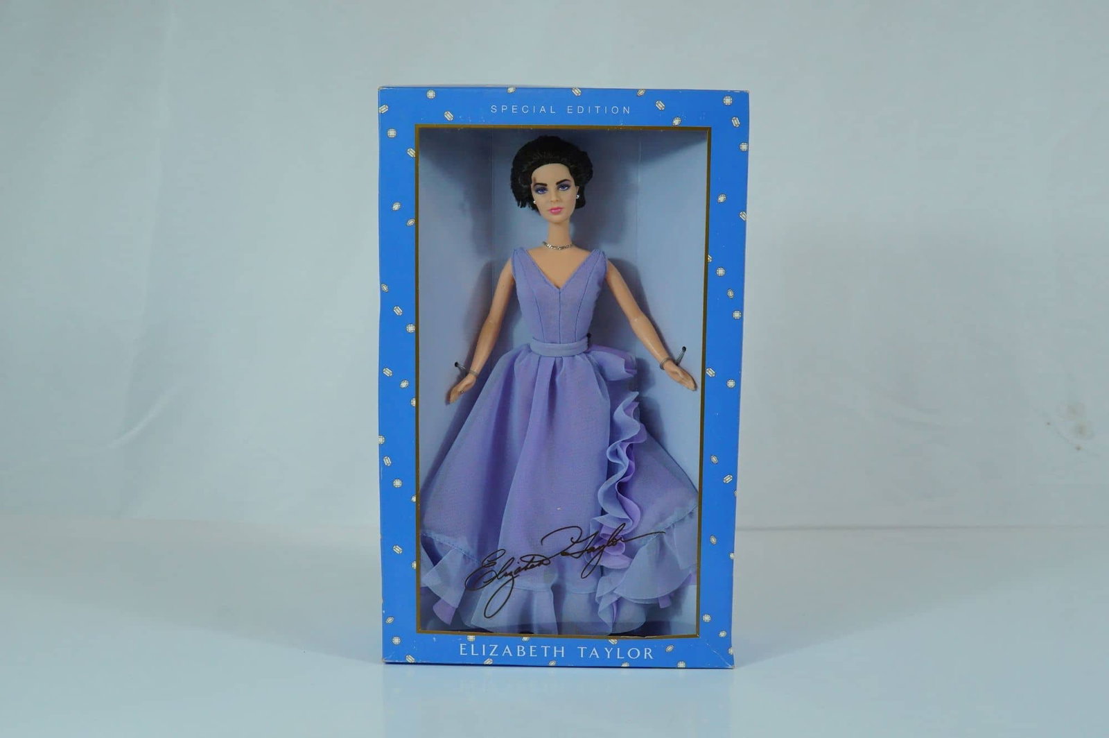 Mattel Elizabeth Taylor White Diamonds Special Edition Doll, 11.5 Inches: Produced by Mattel as part of the Timeless Treasures collection in 2000, this vinyl fashion doll features a detailed likeness of actress Elizabeth Taylor. The doll is designed with fixed, painted viol