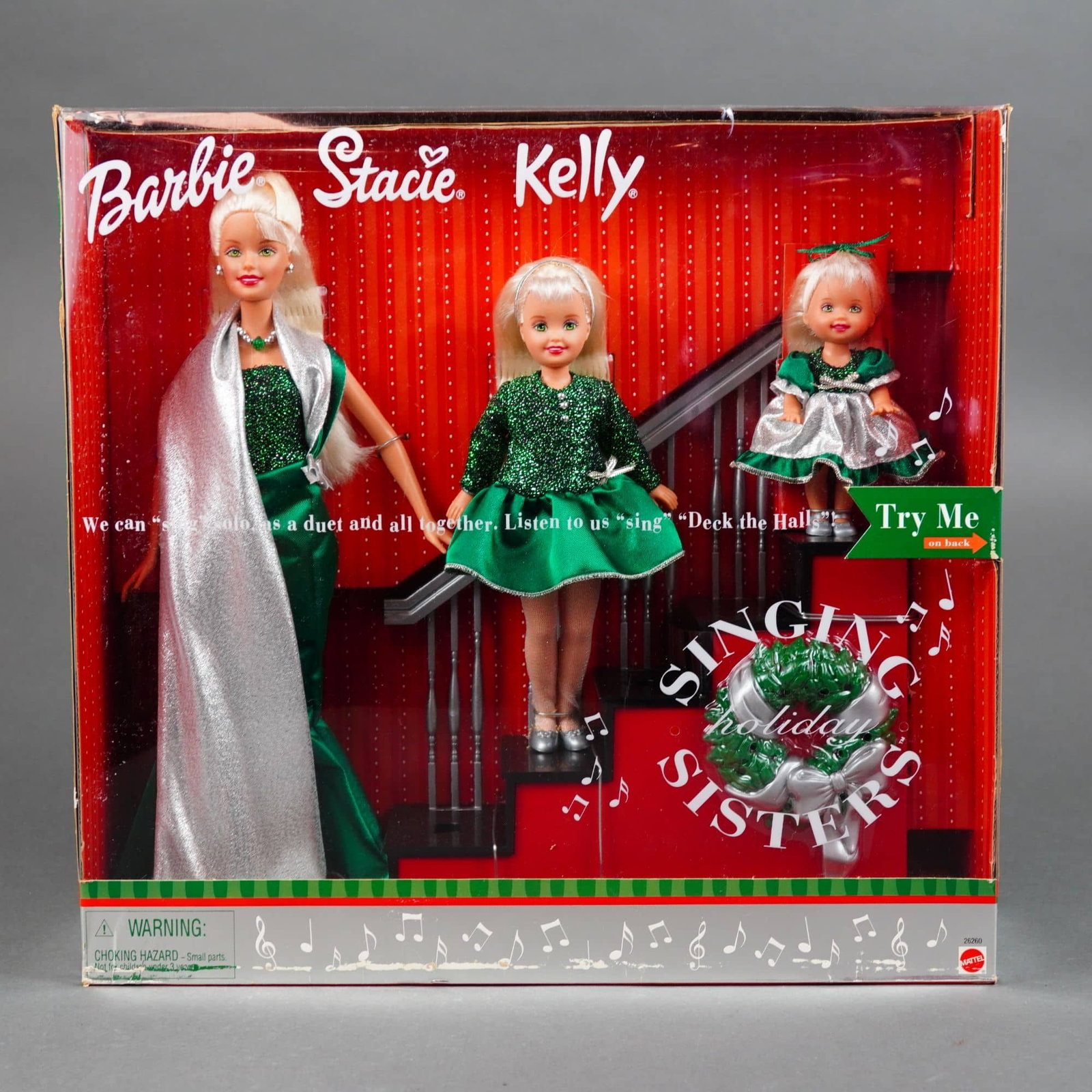 Mattel Singing Holiday Sisters Barbie, Stacie, and Kelly Doll Set, 11.5 inches: Produced by Mattel, Inc. in China, this set of Three vinyl dolls features the Singing Holiday Sisters trio including Barbie, Stacie, and Kelly. Each doll features rooted blonde synthetic hair and fixe