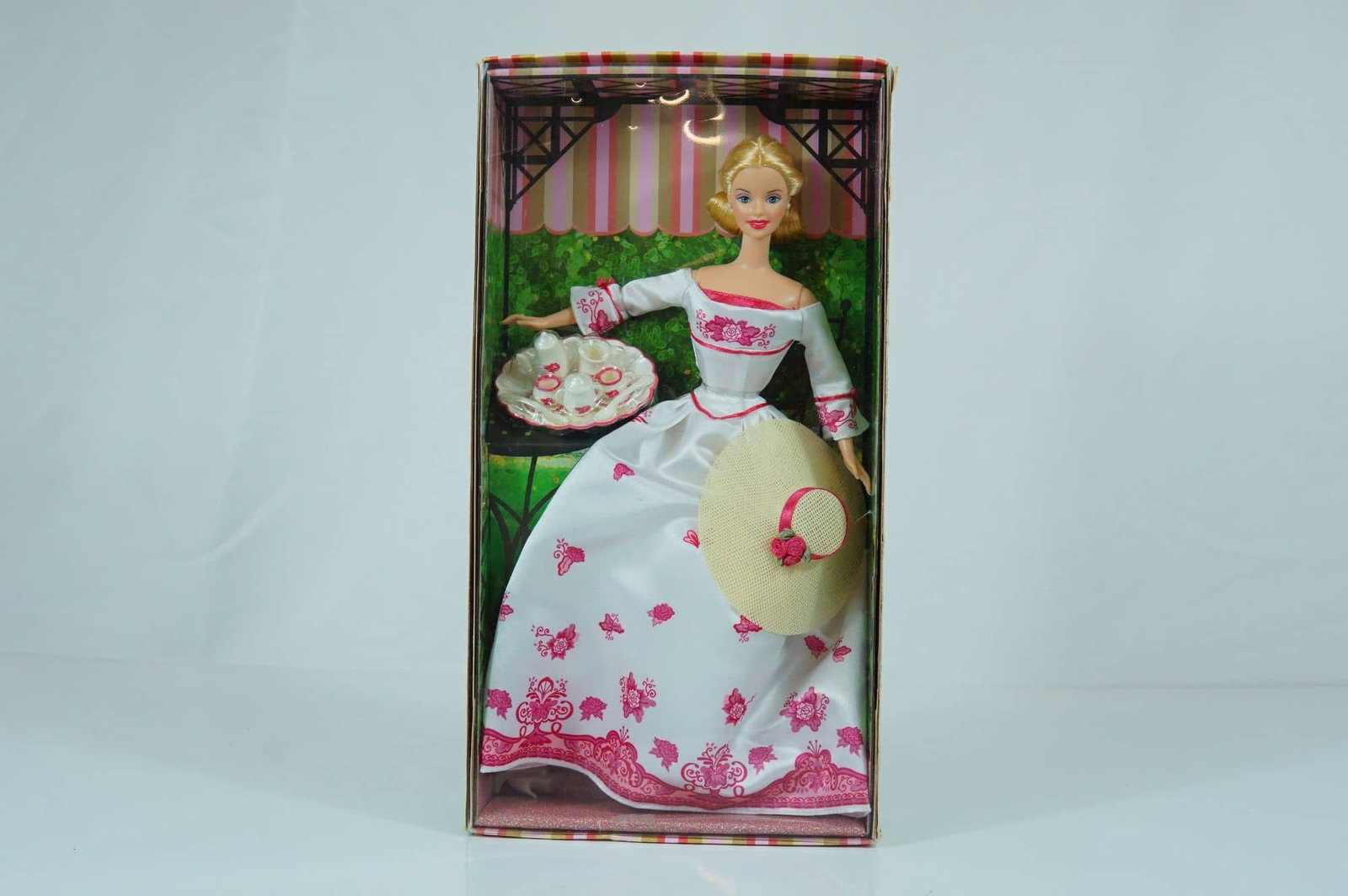 Mattel Victorian Tea Barbie, 11.5 Inches: Mattel vinyl Victorian Tea Barbie doll, model B0787. This Caucasian doll features rooted blonde hair styled in a formal Victorian-era updo and stationary painted blue eyes with detailed eyelashes. She