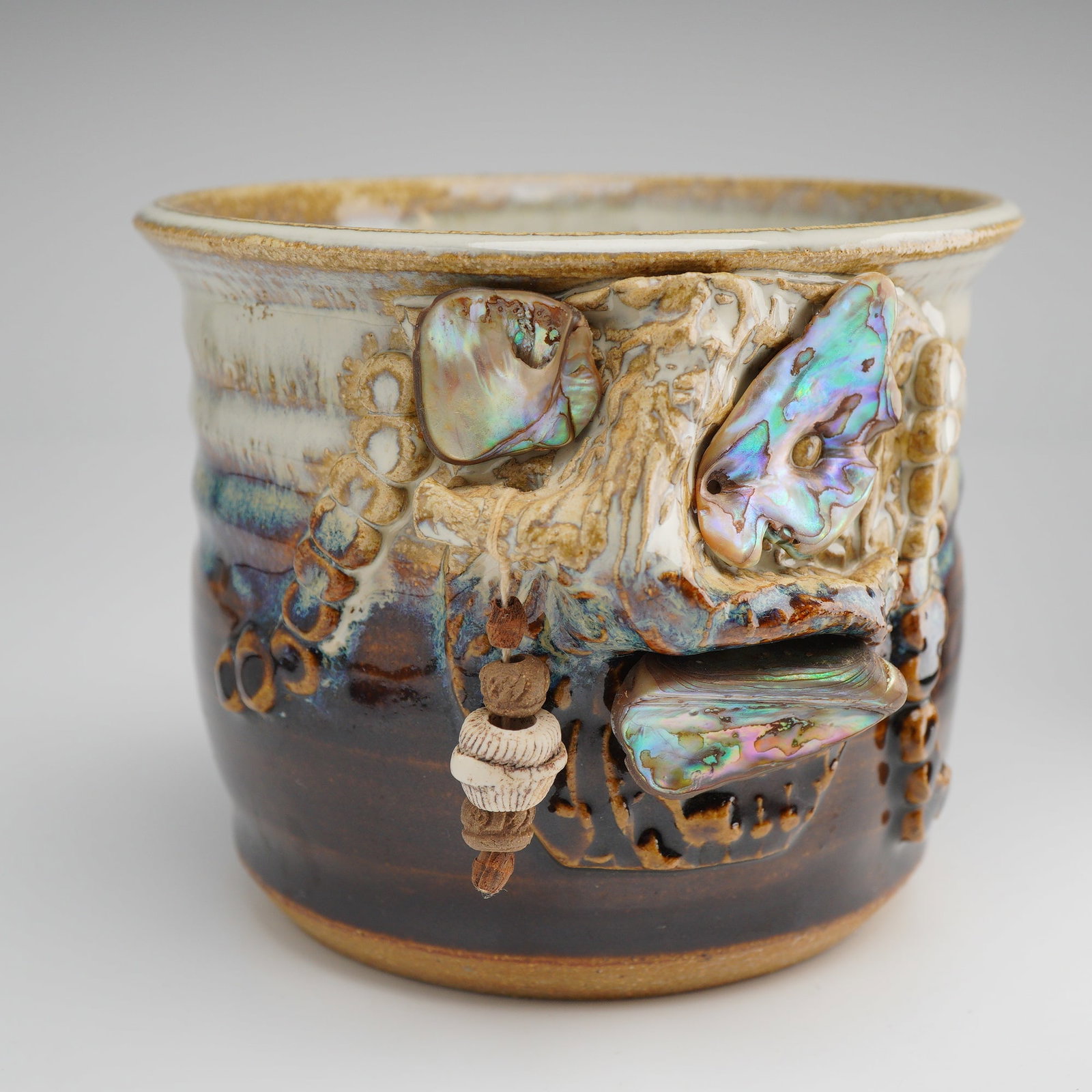 Adele Feinstein Studio Pottery Vase Planter: Handcrafted studio pottery vessel by American ceramic artist Adele Feinstein. This richly textured example features an organic, coastal-inspired design with applied sculptural elements, including irid