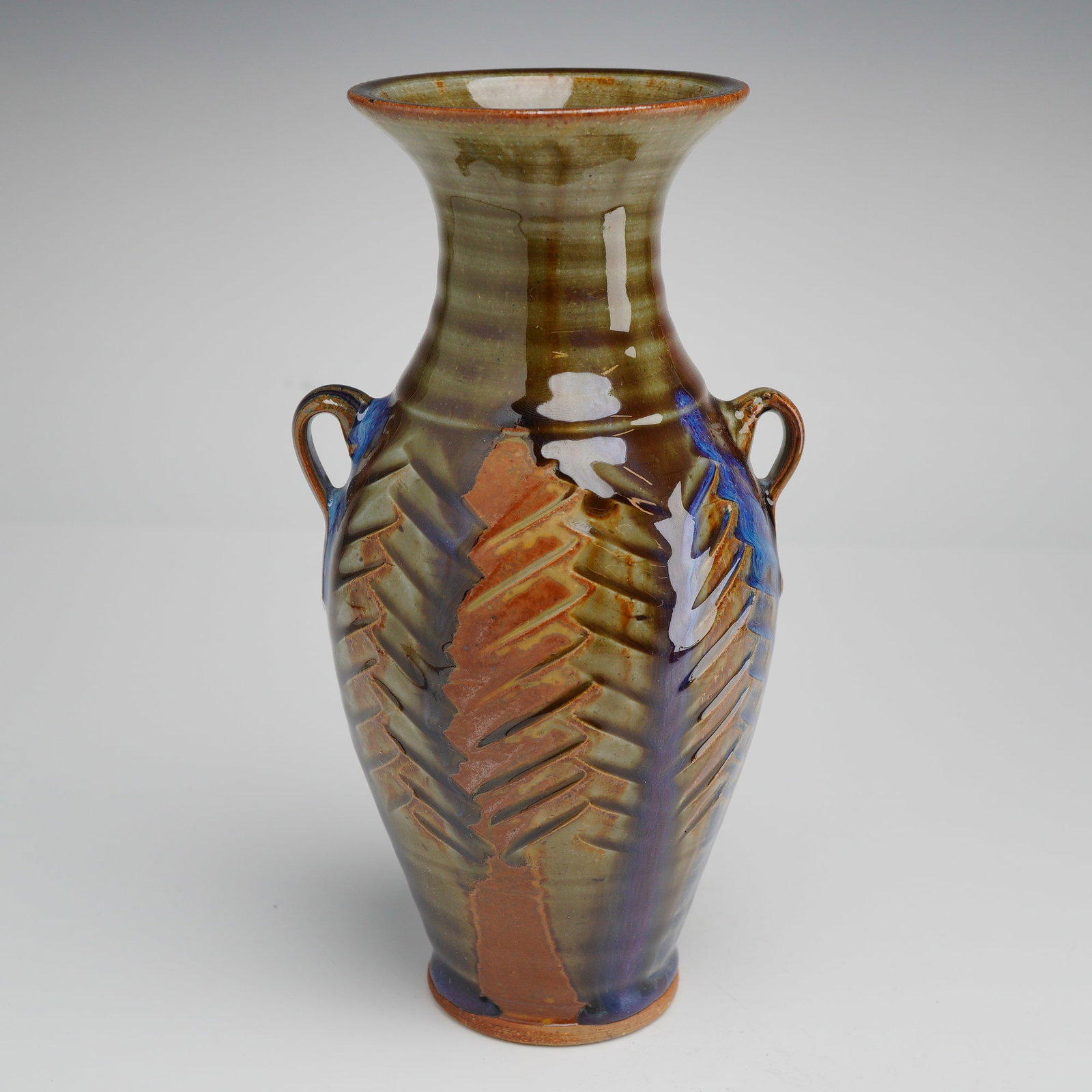 Hamilton Williams Studio Pottery Vase: Wheel-thrown and hump-molded stoneware vase by North Carolina studio potter Hamilton Williams, dated 2013. The form features a tall, gently tapering body rising to a flared rim, accented by applied lo