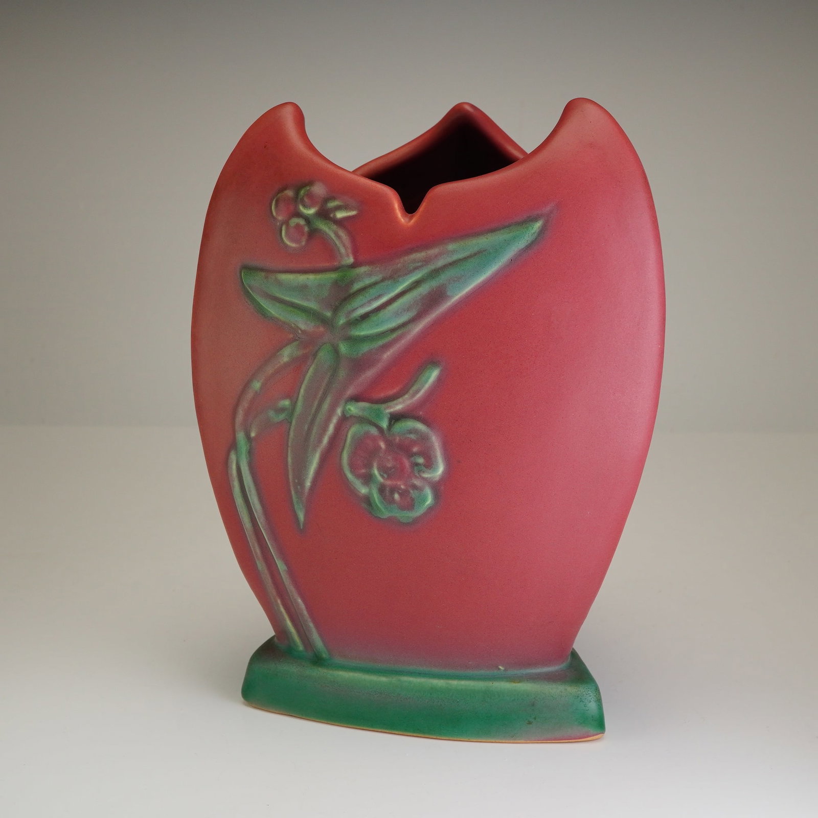 Weller Pottery Tutone Ware Art Deco Triangular Ceramic Floral Vase: An American Art Deco ceramic vase from the Tutone Ware line by Weller Pottery, Zanesville, Ohio, circa 1920-1930. The vessel features a distinctive triangular, three-sided form terminating in a scallo