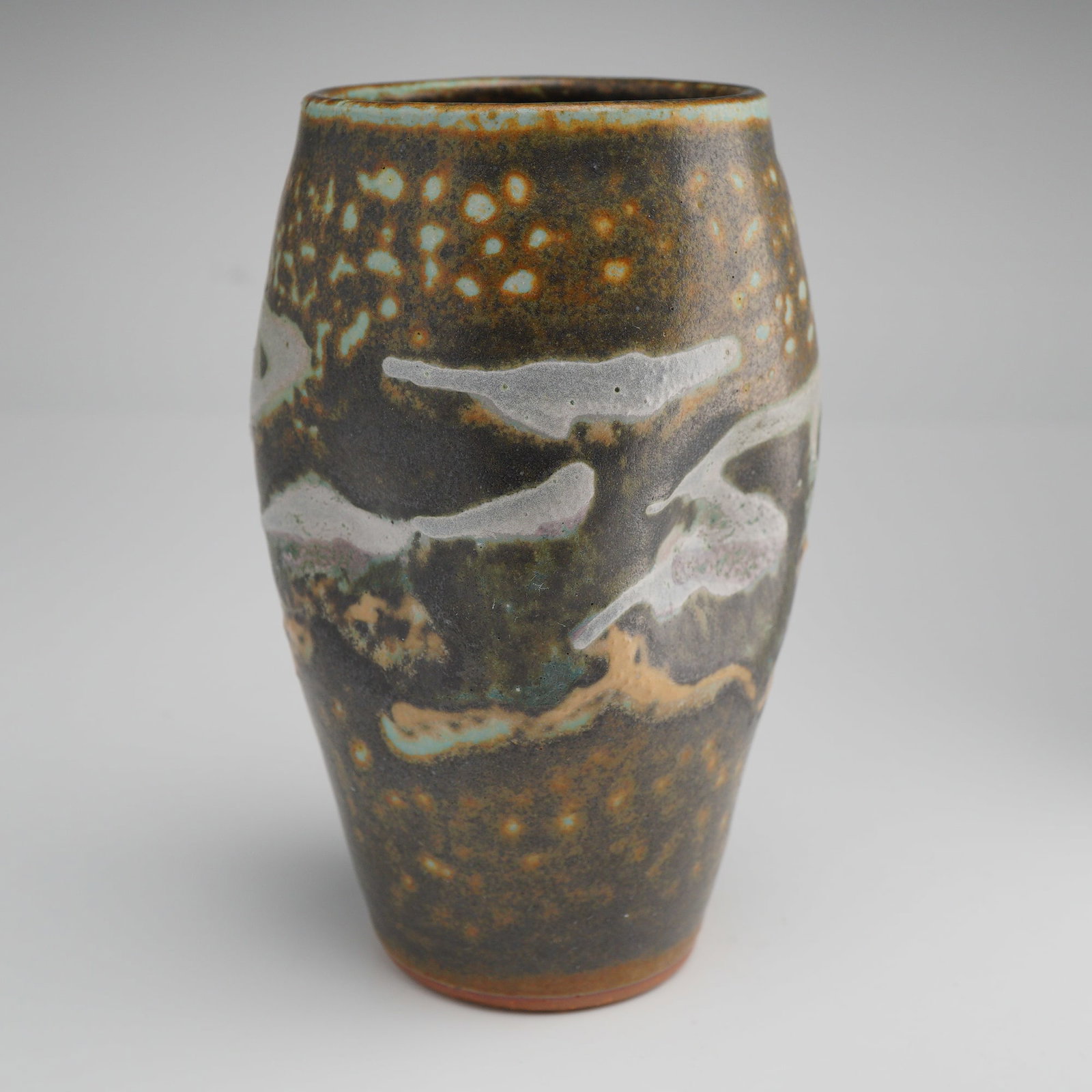 DirtWorks Pottery Studio Vase by Dan Triece: Studio pottery vase by Dan Triece of DirtWorks Pottery. This wheel-thrown ceramic vase features a gently tapering form with rounded shoulder and subtly flared rim. The surface is finished in a richly