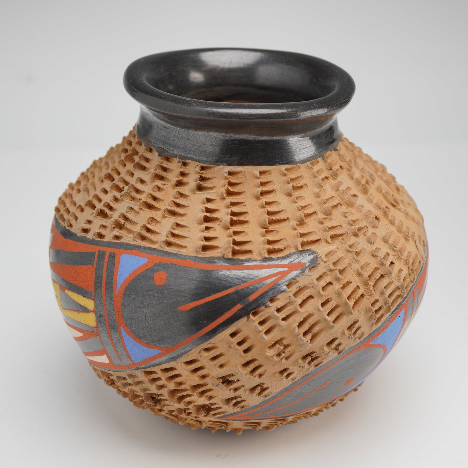 Baja Pueblo Pottery By Mario Olivas, Mata Ortiz Polychrome Vase: This contemporary Mexican earthenware vessel is a handcrafted piece by artist Mario Olivas. The globular Vase features a short, flared, and highly burnished black neck and rim. The upper shoulder and