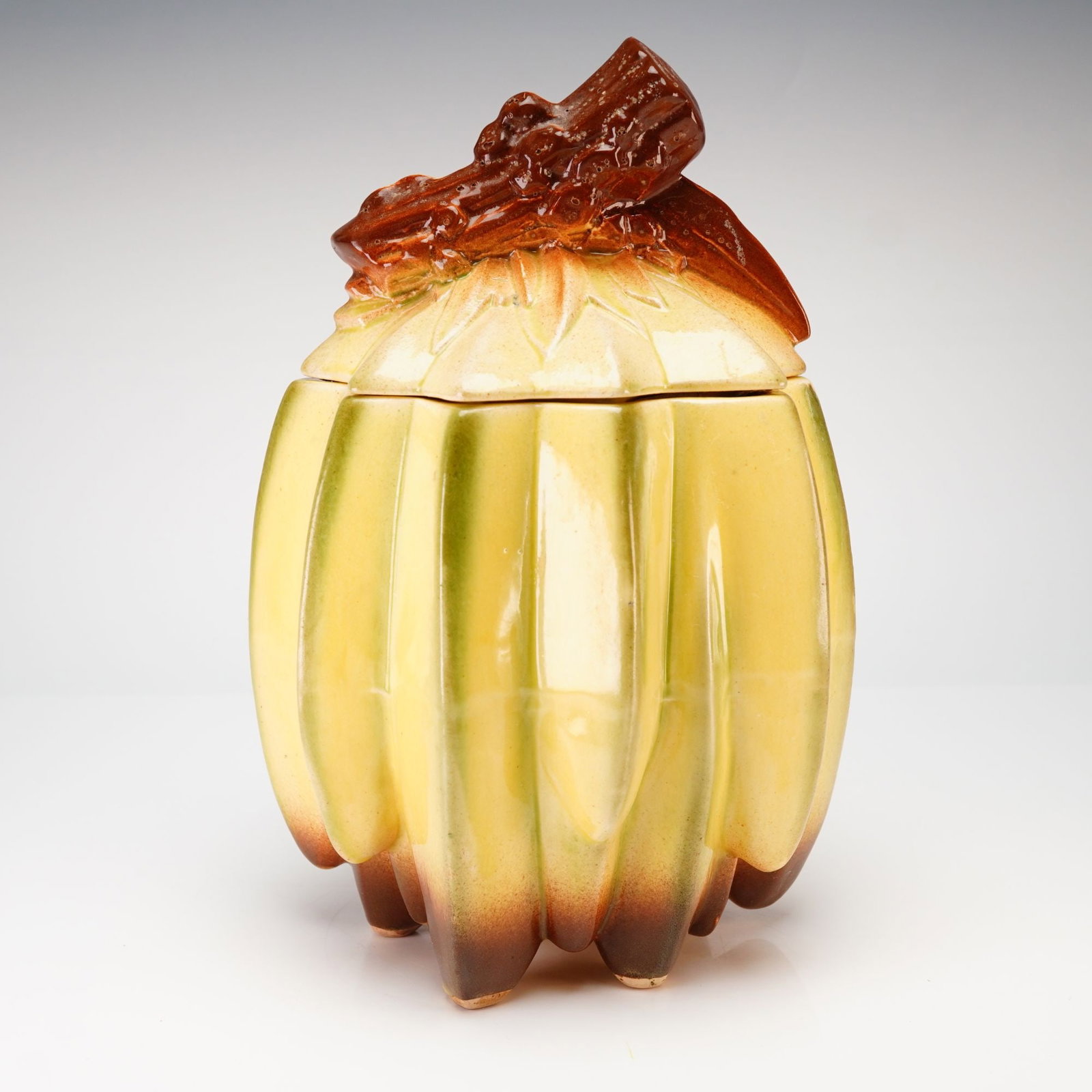 McCoy Banana Bunch Cookie Jar: A vintage McCoy Pottery figural ceramic cookie jar in the Banana Bunch pattern, dating to the mid-century period. The vessel is modeled as a vertical cluster of bananas finished in a yellowish-green