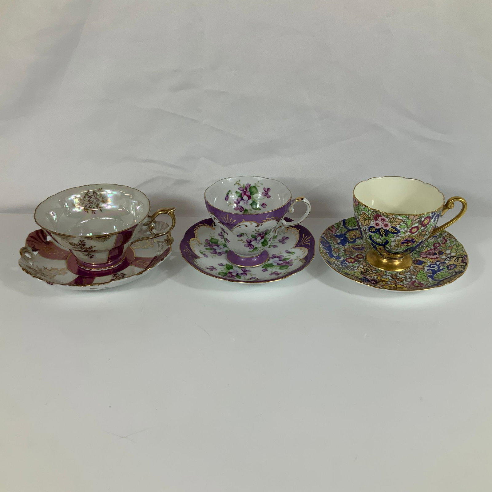 Three Porcelain Teacup and Saucer Sets Including Shelley Paisley and Heinrich and Co. (1 of 3)
