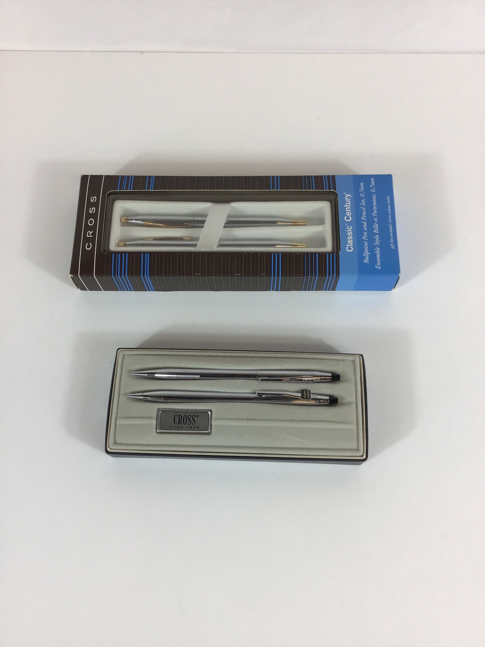 Two Cross Classic Century Lustrous Chrome Ballpoint Pen and Mechanical Pencil Sets: This lot consists of two matched Cross Classic Century writing instrument sets. Each set includes one twist-action ballpoint pen and one twist-action mechanical pencil designed for 0.7mm lead. The ins