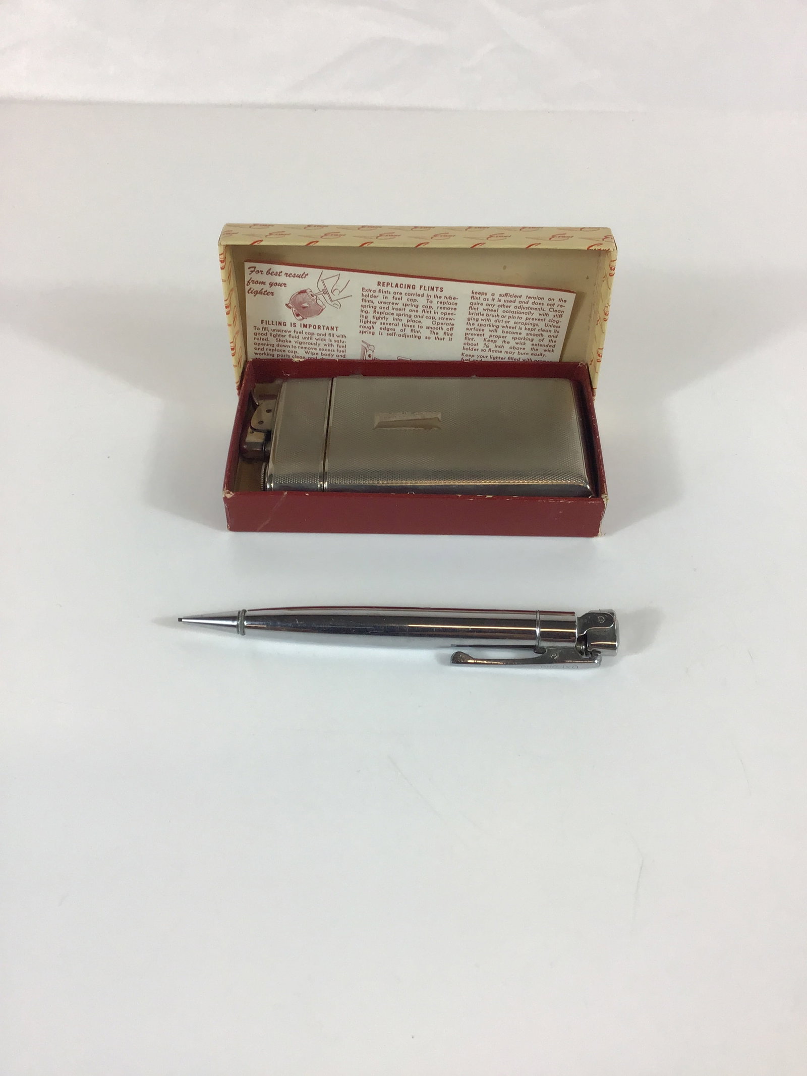 Two Vintage Personal Accessories Including an Evans Lighter and Case Combo and an Oxford Lighter (1 of 3)