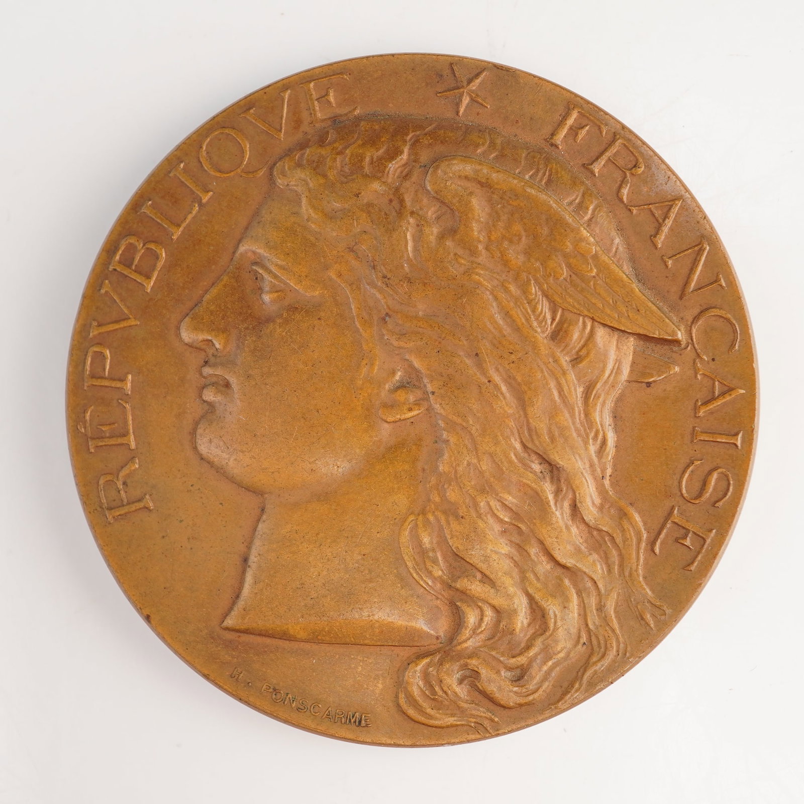 FR 1897 Ministry of Agriculture Award Medal, Rennes, Bronze, Extremely Fine: Artist Hubert Ponscarme. Winged Marianne obverse. Key identifiers include the signature H. PONSCARME on both the obverse and reverse. The reverse features a central rectangular plaque inscribed RENNES