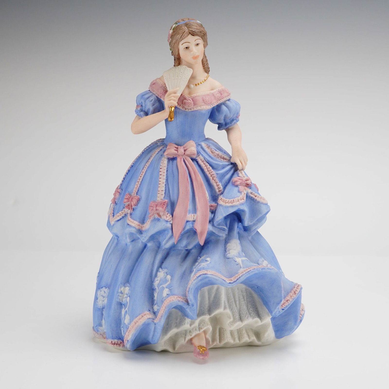 Wedgwood The Imperial Banquet Limited Edition Porcelain Figurine: This Wedgwood fine porcelain figurine, titled The Imperial Banquet 1855, was commissioned by Spink for the Spink Modern Collections Limited. The figure is modeled as a lady in Victorian-style attire w
