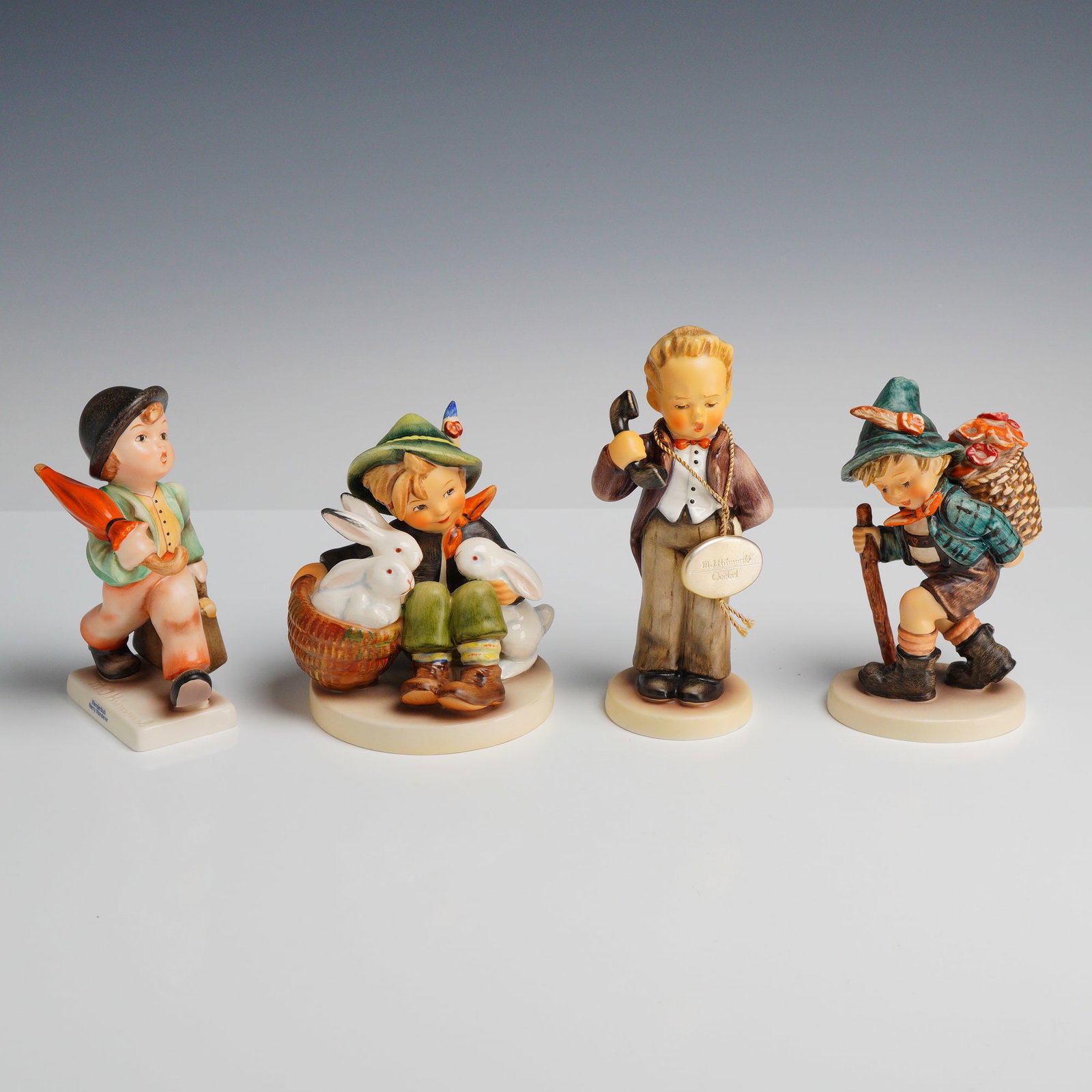 Goebel M.I. Hummel Figurines, The Little Boss, Flower Vendor, Playmates, and Merry Wanderer (1 of 3)