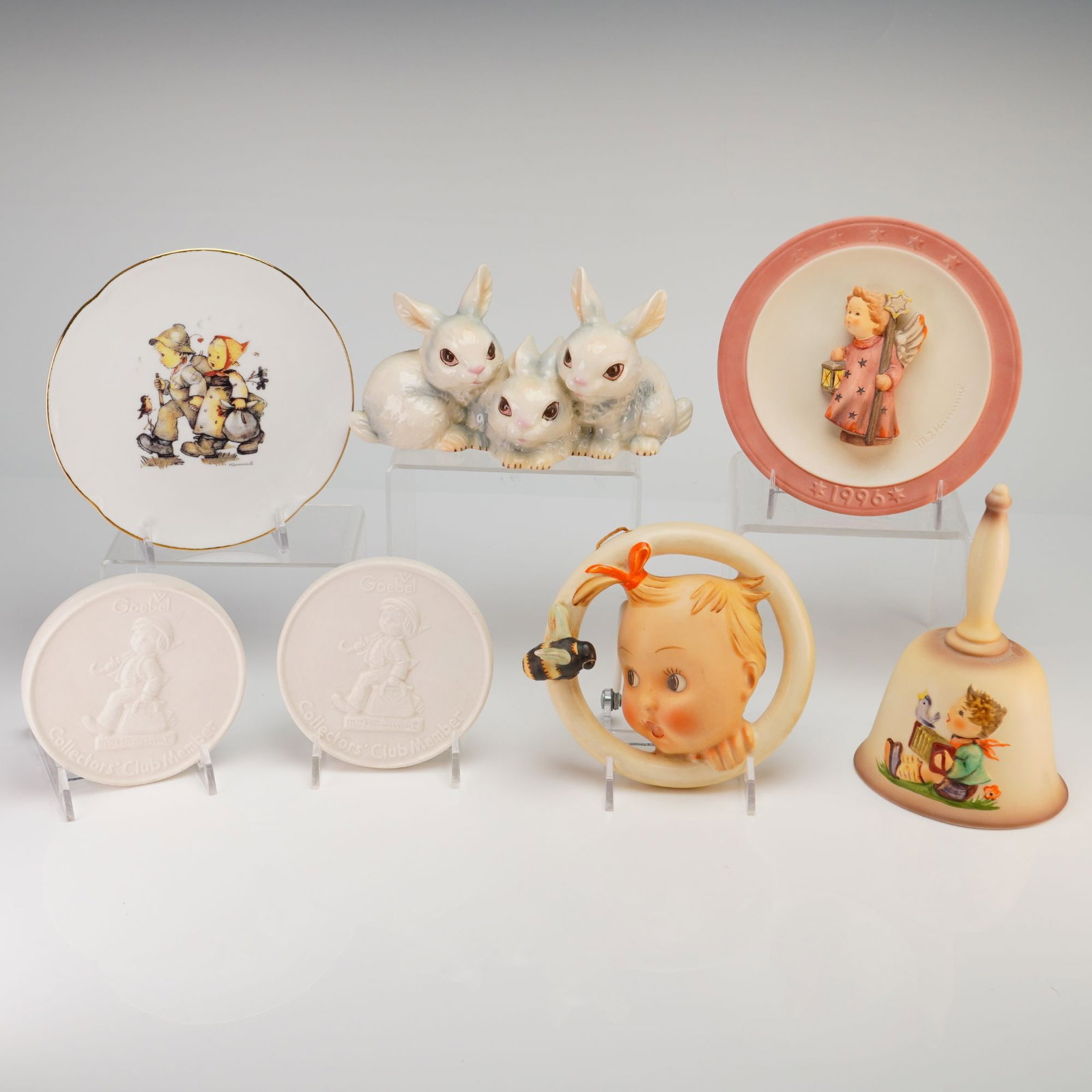 A Collection of Seven Goebel M.I. Hummel Ceramic Items Including Figurines and Plates (1 of 3)