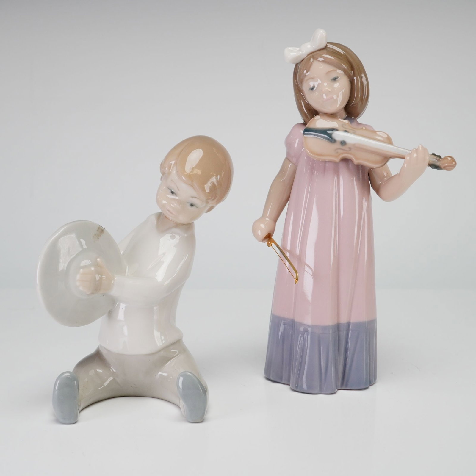 2pc Nao and Lladro Porcelain Figurines, Boy with Cymbals and Girl with Violin (1 of 3)