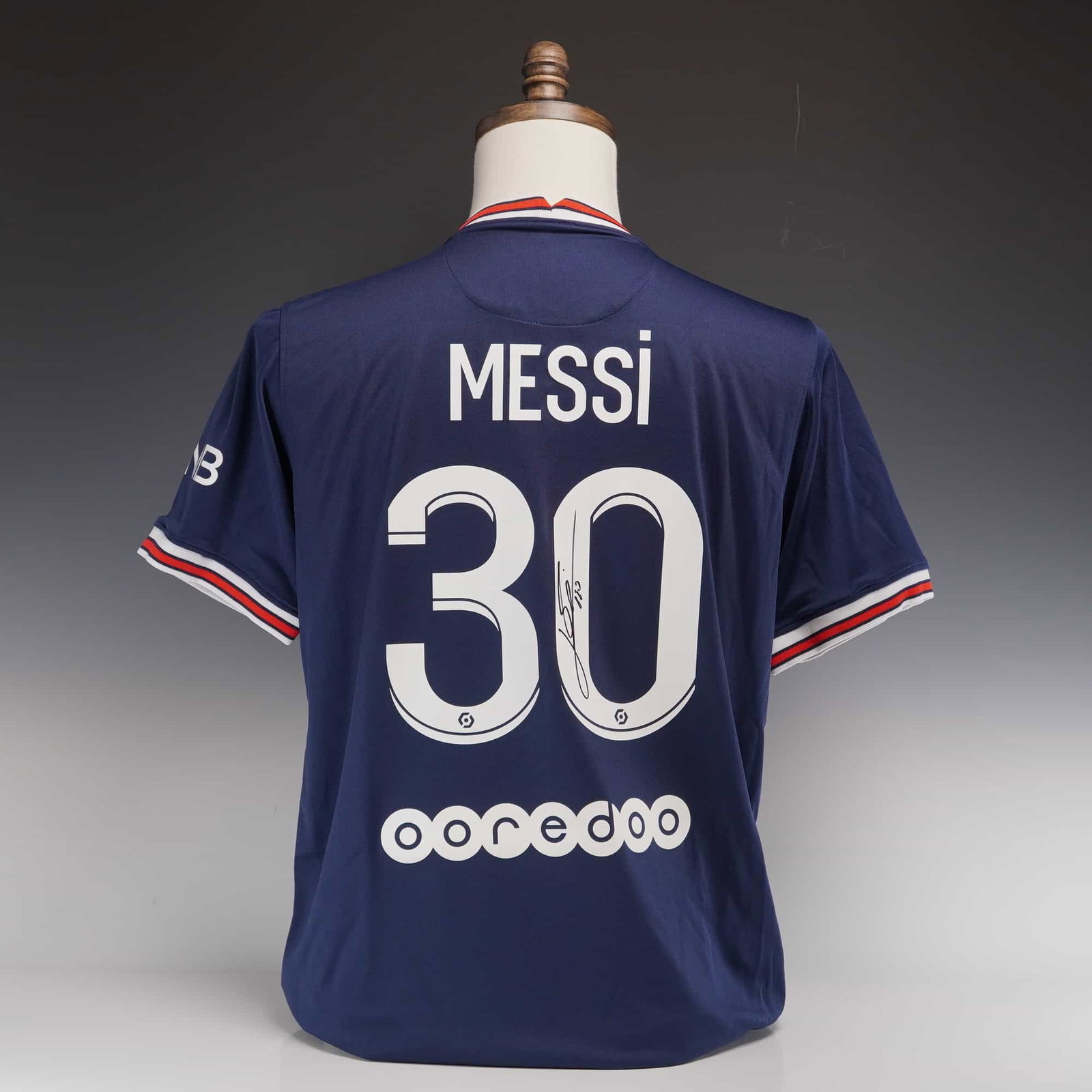 Lionel Messi Official Back Signed Paris Saint-Germain 2021-22 Home Jersey with Icons.com COA: This is an official Lionel Messi back signed Paris Saint-Germain 2021-22 home shirt, representing the player's historic debut season with the French club. The jersey is a Jordan Brand production featu