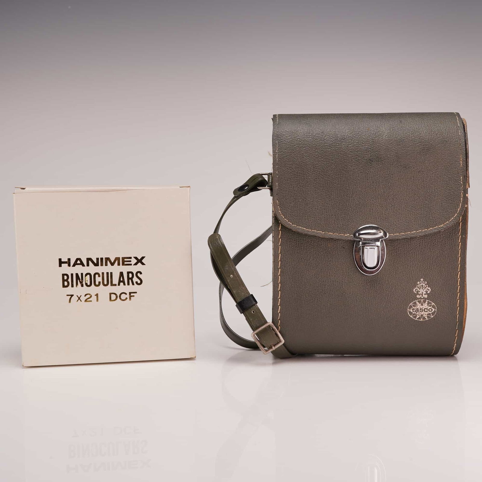 2pc Vintage Binoculars Including Tasco 7x35 and Hanimex 7x21: This lot features two sets of vintage binoculars. The first is a Tasco Model No. 11 Ultra Wide Angle Porro prism binocular. Specifications include 7x magnification and 35mm objective lenses with a fie