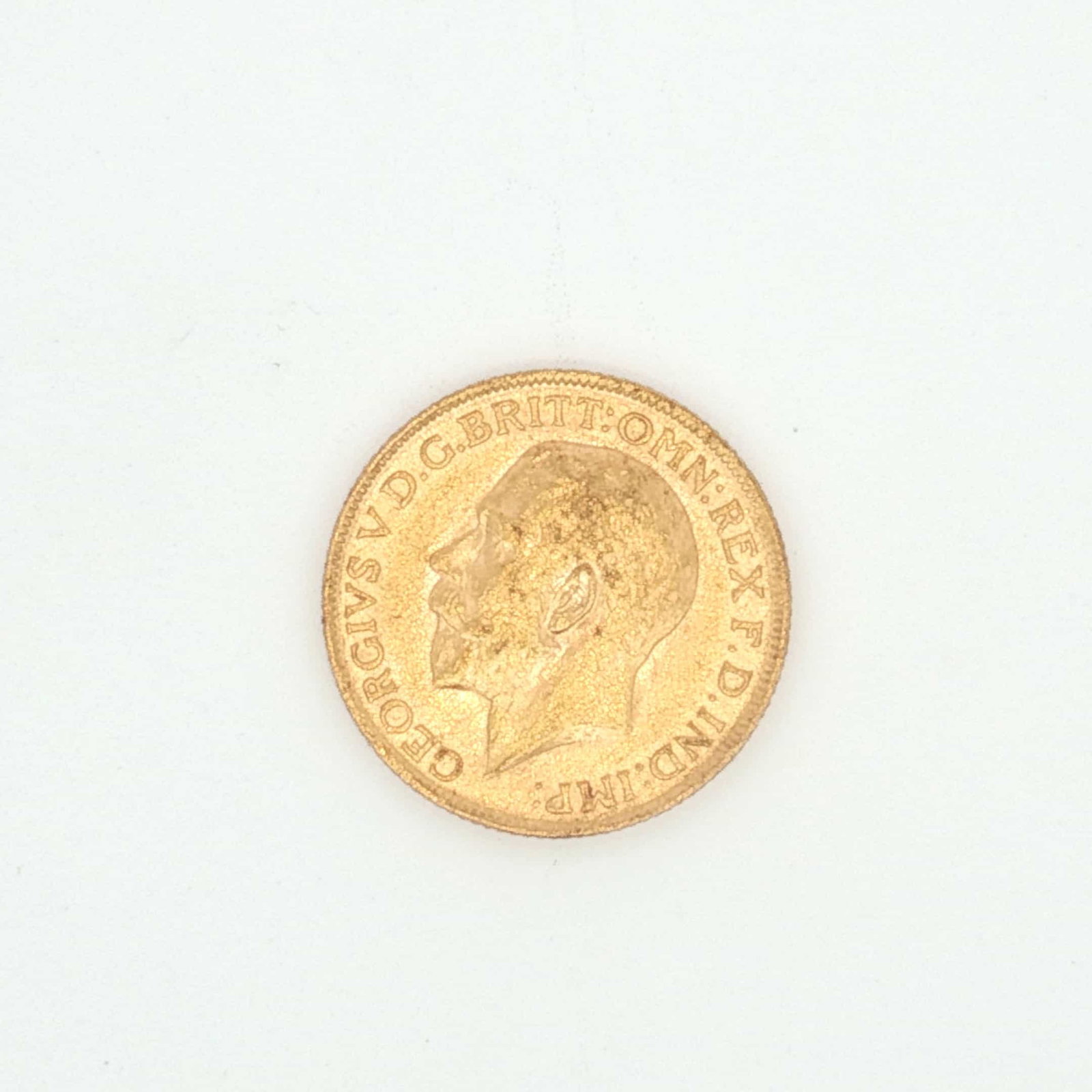 1912 UK 1 Sovereign King George V Gold Coin: Minted by the Royal Mint. The obverse side depicts the uncrowned portrait of King George V facing left, legend around. The reverse side depicts St. George on horseback slaying the dragon right. Gold c