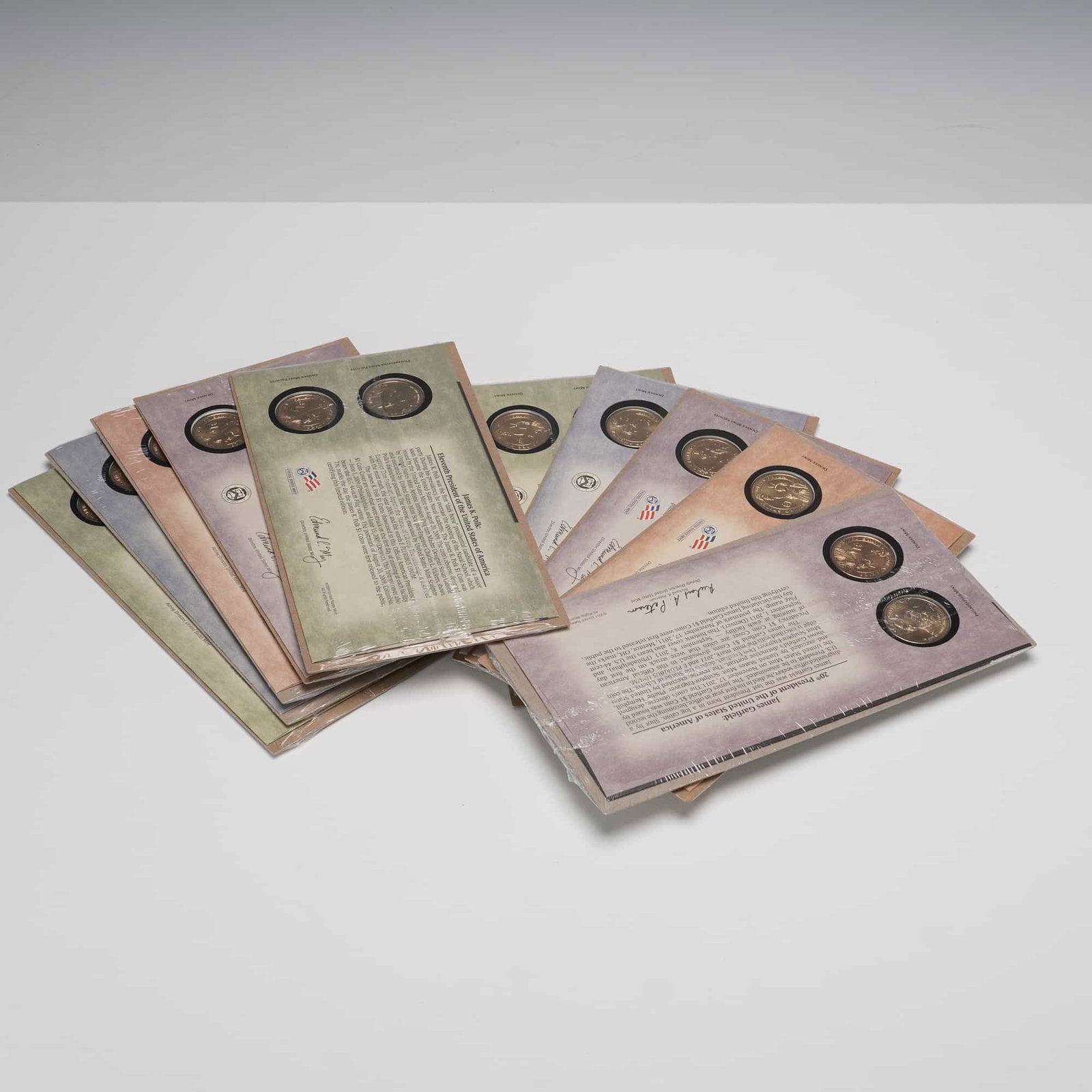 10pc U.S. Mint Presidential $1 First Day Coin Covers: This lot consists of 10 United States Mint Presidential $1 Coin Covers, each sealed in its original government packaging. Included are covers honoring Rutherford B. Hayes, James K. Polk, James Buchana