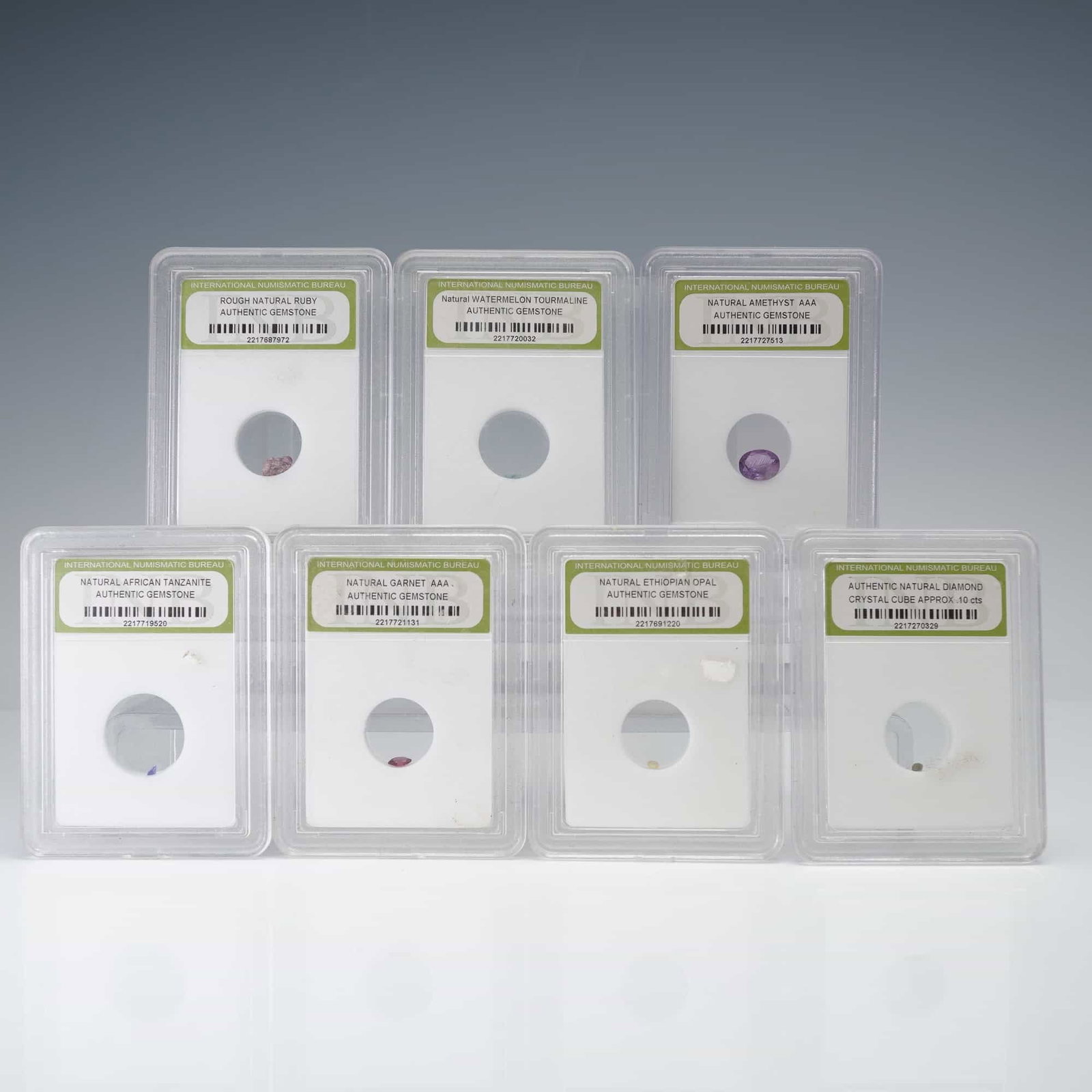 7pc Assorted Natural Gemstones: This 7-piece group offers a selection of seven certified stones, including faceted and rough examples across multiple varieties, presenting a mix of color and material. Identified stones are Natural G