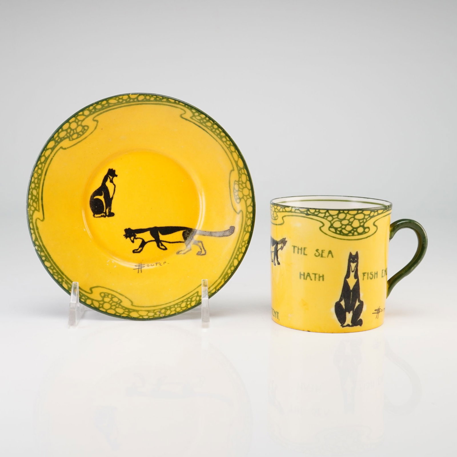 2pc Royal Doulton by David Henry Souter Kateroo Series Ware Cup and Saucer, Be Content the Sea Hath: This Royal Doulton earthenware cup and matching saucer are part of the Series Ware collection featuring illustrations by David Henry Souter, often referred to as the Kateroo or Souter's Cats series. T