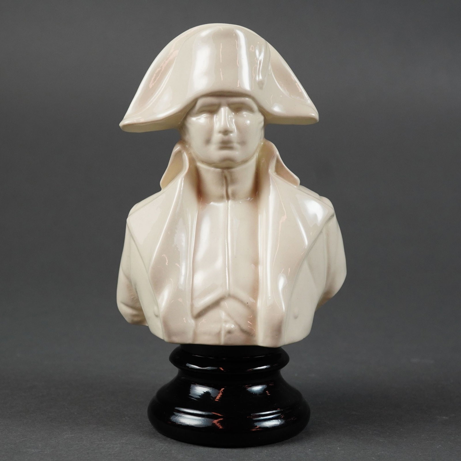 Michael Sutty Fine China, Napoleon Bonaparte Bust: This rare white on black base Michael Sutty fine china bust of Napoleon Bonaparte is a limited edition porcelain figure. The subject is depicted in a traditional military uniform with a high collar an
