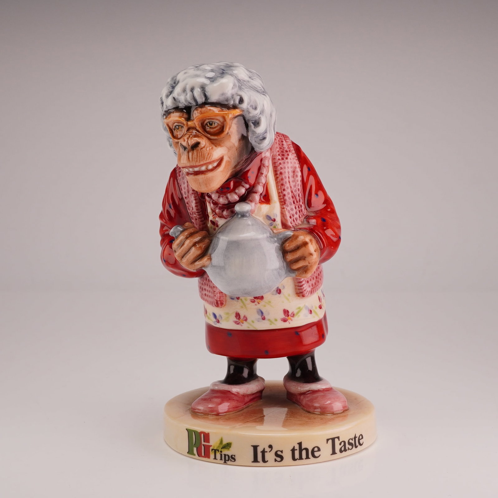Royal Doulton Advertising Figurine, PG Tips Chimp - Ada MCL25: Introduced in 1930 by Brooke Bond under the name "Pre-Gestee" and originally promoted as a digestive aid, PG Tips grew into one of Britain's leading tea brands, distinguished by its use of the top two