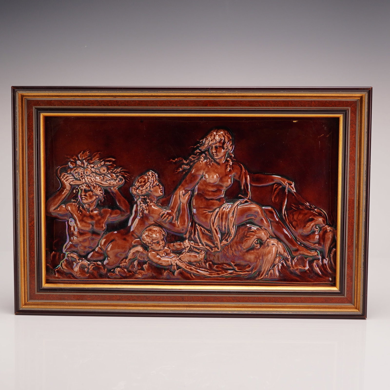 Wedgwood Brown Glazed High Relief Framed Mythological Relief Wall Plaque: This high-relief ceramic plaque is identified as Wedgwood, featuring a complex mythological scene molded in earthenware. The composition depicts an allegory of the Nereids, a design frequently associa