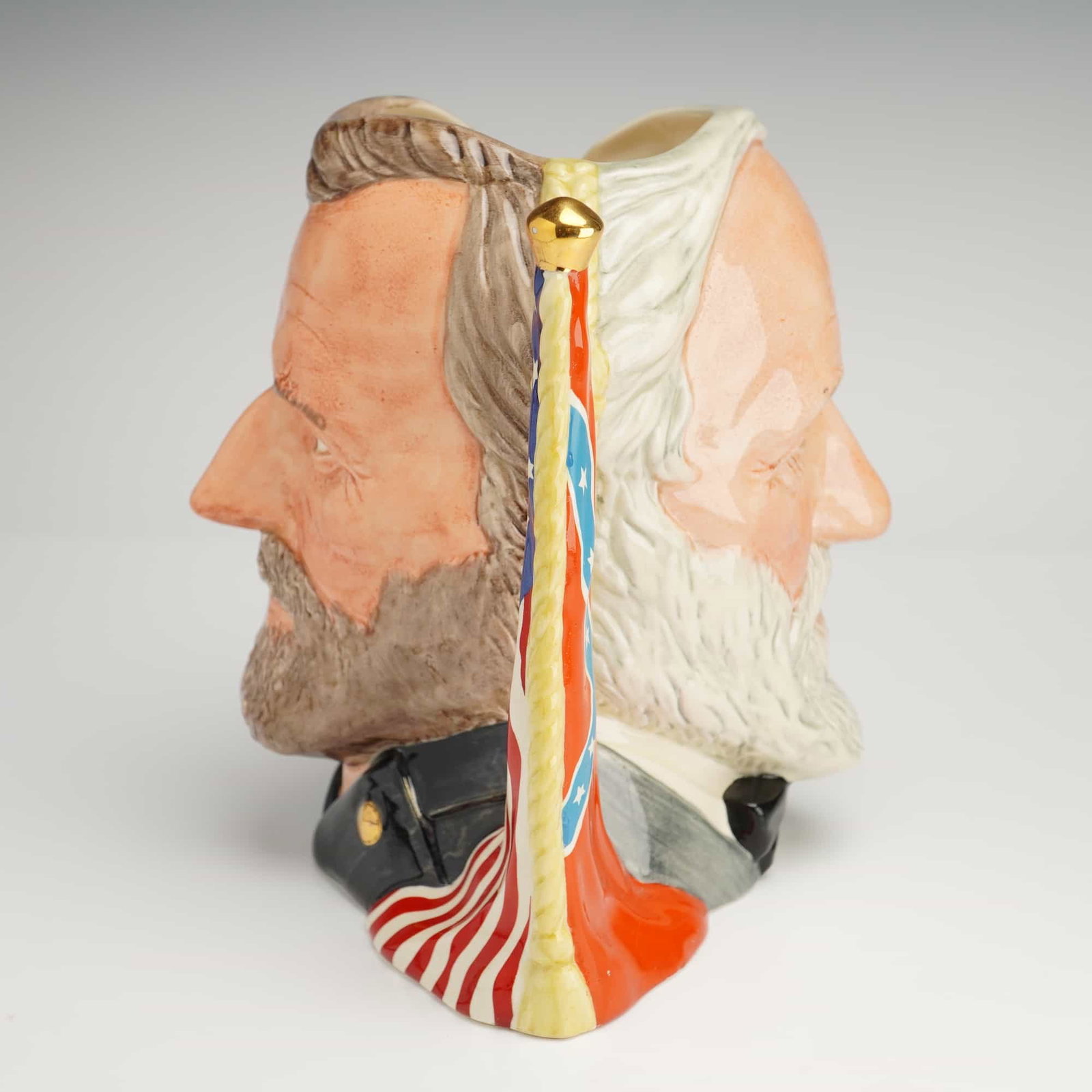 Royal Doulton Double-Face Character Jug, Ulysses S. Grant And Robert E. Lee D6698: Featuring dual portrait design in black, grey, brown, and red coloration. Designed by Michael Abberley. Series: The Antagonists' Collection. Issued 1983 in a limited edition of 268 out of 9,500 pieces