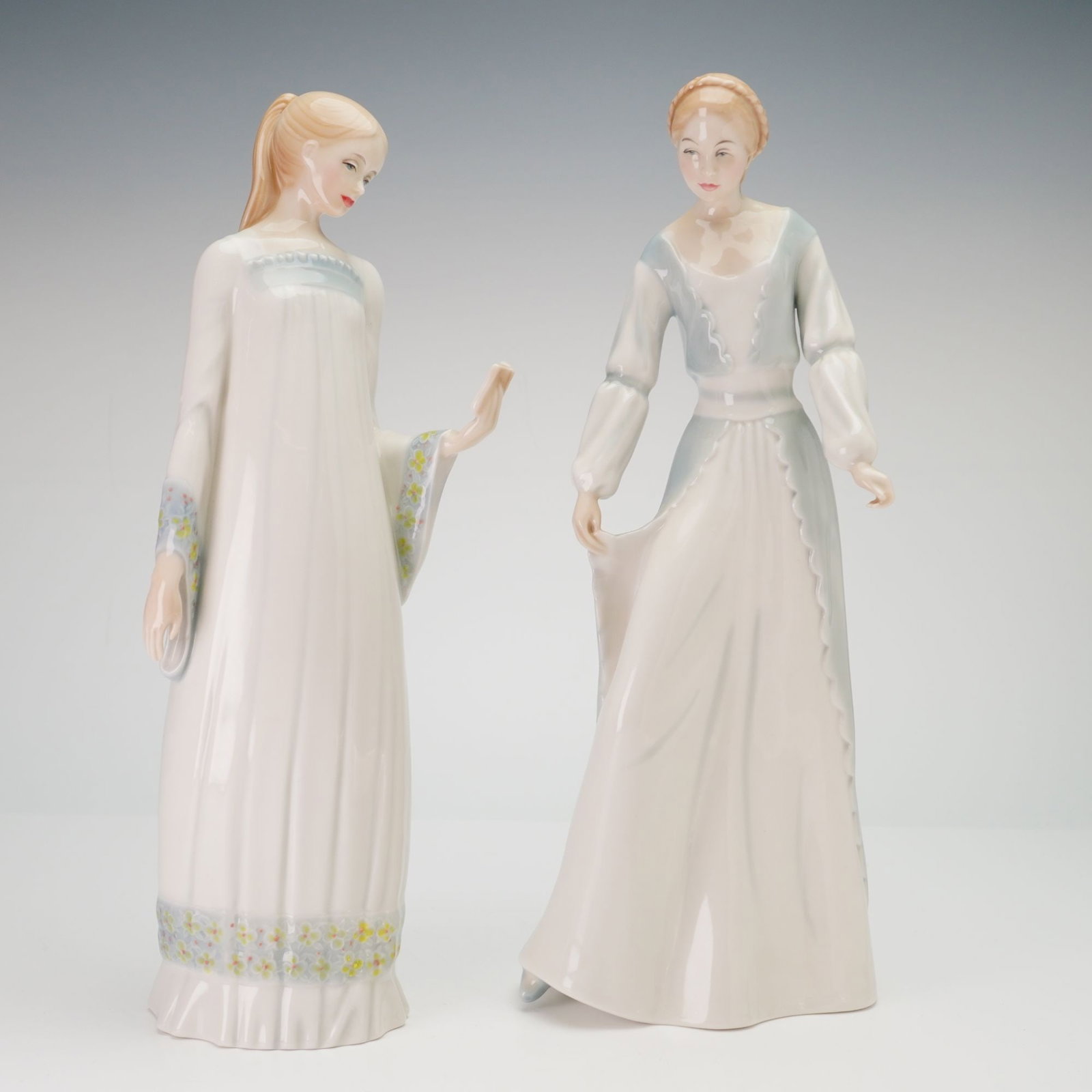 2pc Royal Doulton Reflections Porcelain Figurines, Secret Moment and Demure: This group of glazed porcelain figurines is from the Royal Doulton Reflections series, produced in England. The first figurine, titled Secret Moment (HN 3106), was modeled by Robert Jefferson and depi