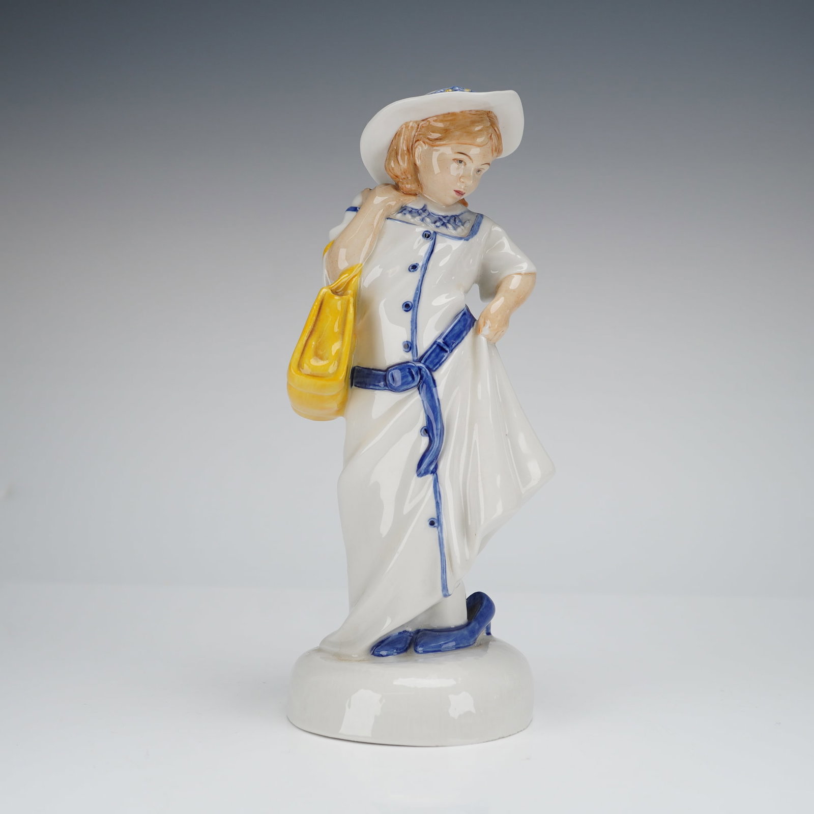 Royal Doulton Childhood Days Dressing Up HN2964 Figurine: A single glazed porcelain figurine by Royal Doulton, titled 'Dressing Up' and identified by the production number H.N. 2964. This piece is part of the 'Childhood Days' series, dated 1981. The figure d